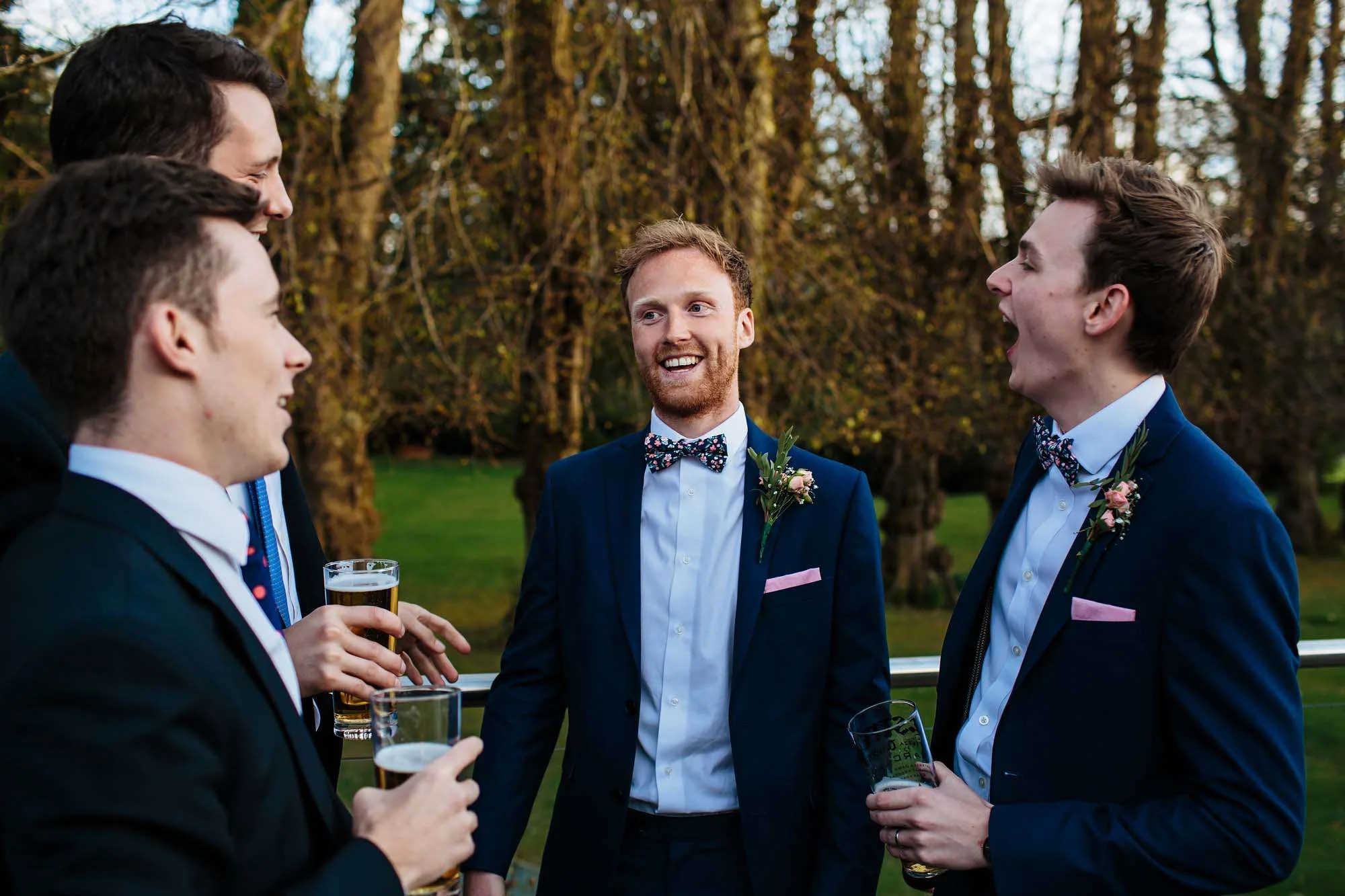 Groom and the boys laughing at a wedding at Armathwaite Hall