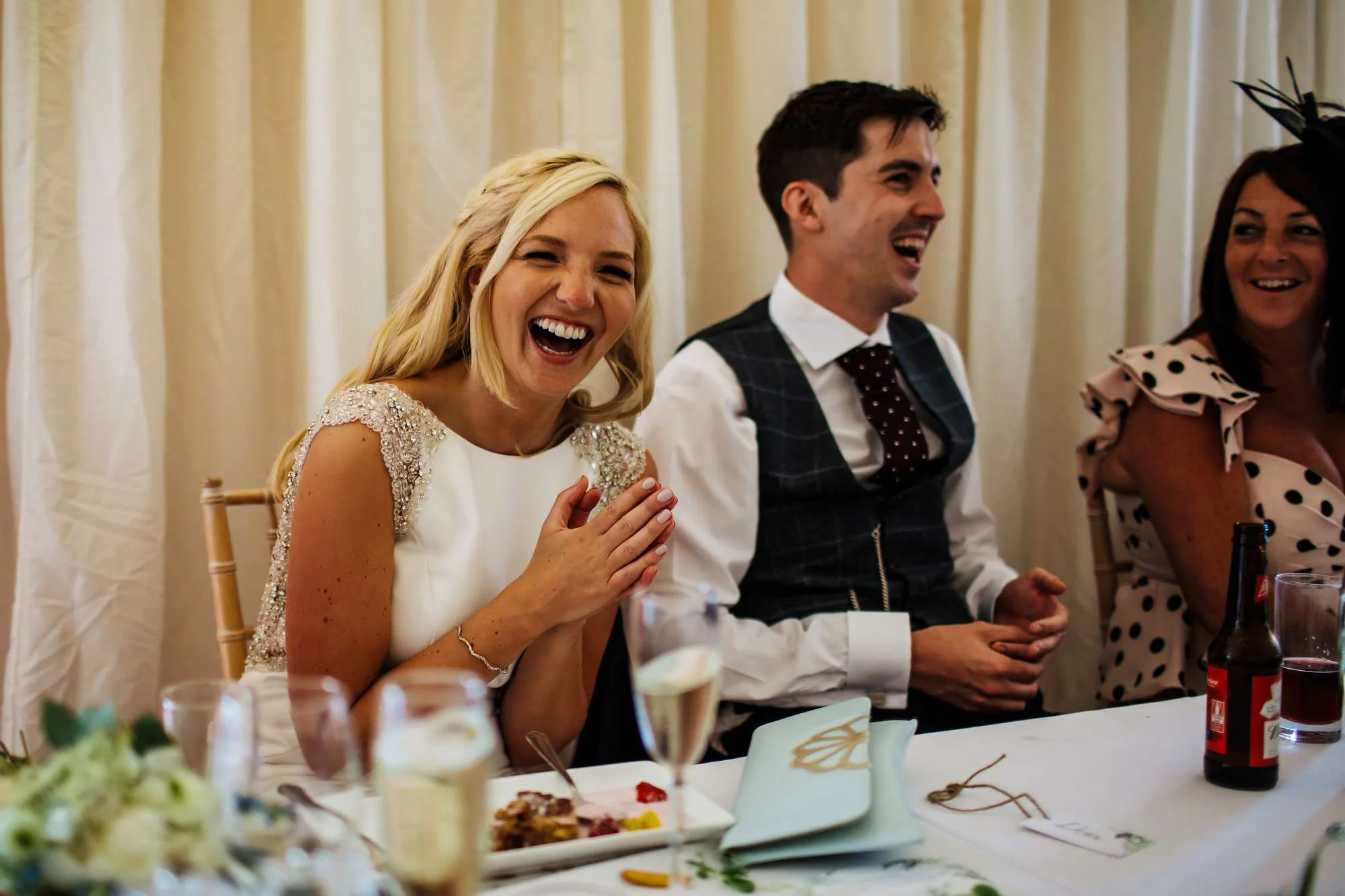 Bride laughing during the speeches at her Leeds wedding