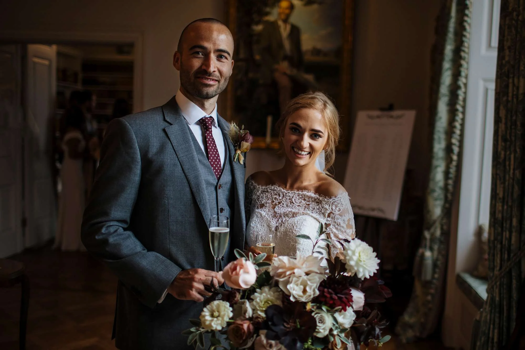 Bride and groom with champagne at their wedding
