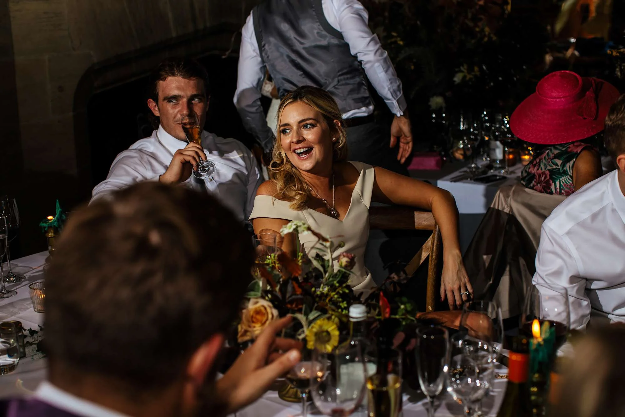 Wedding guests laughing during the speeches