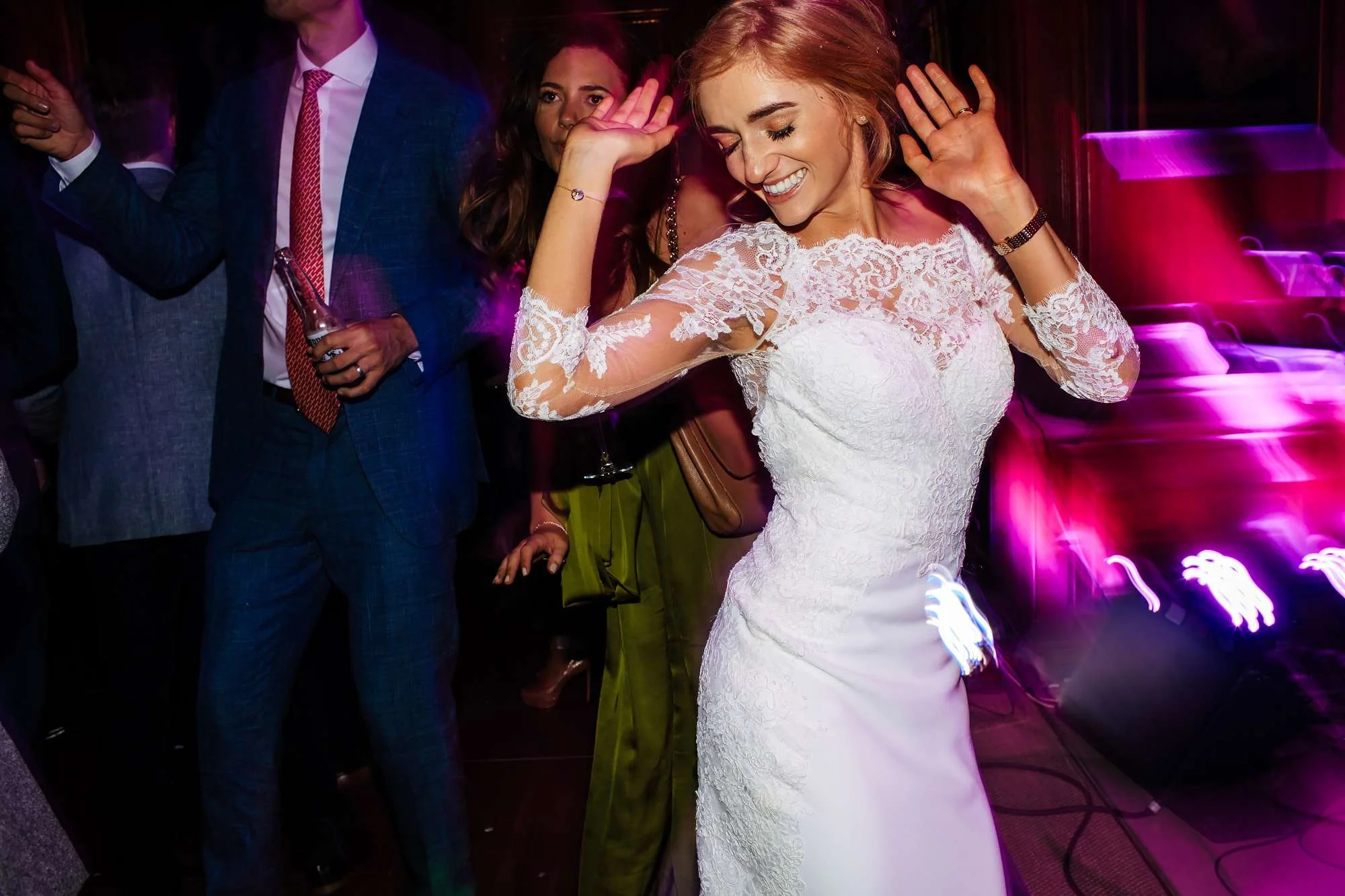 Bride dancing at her wedding at Cowdray House