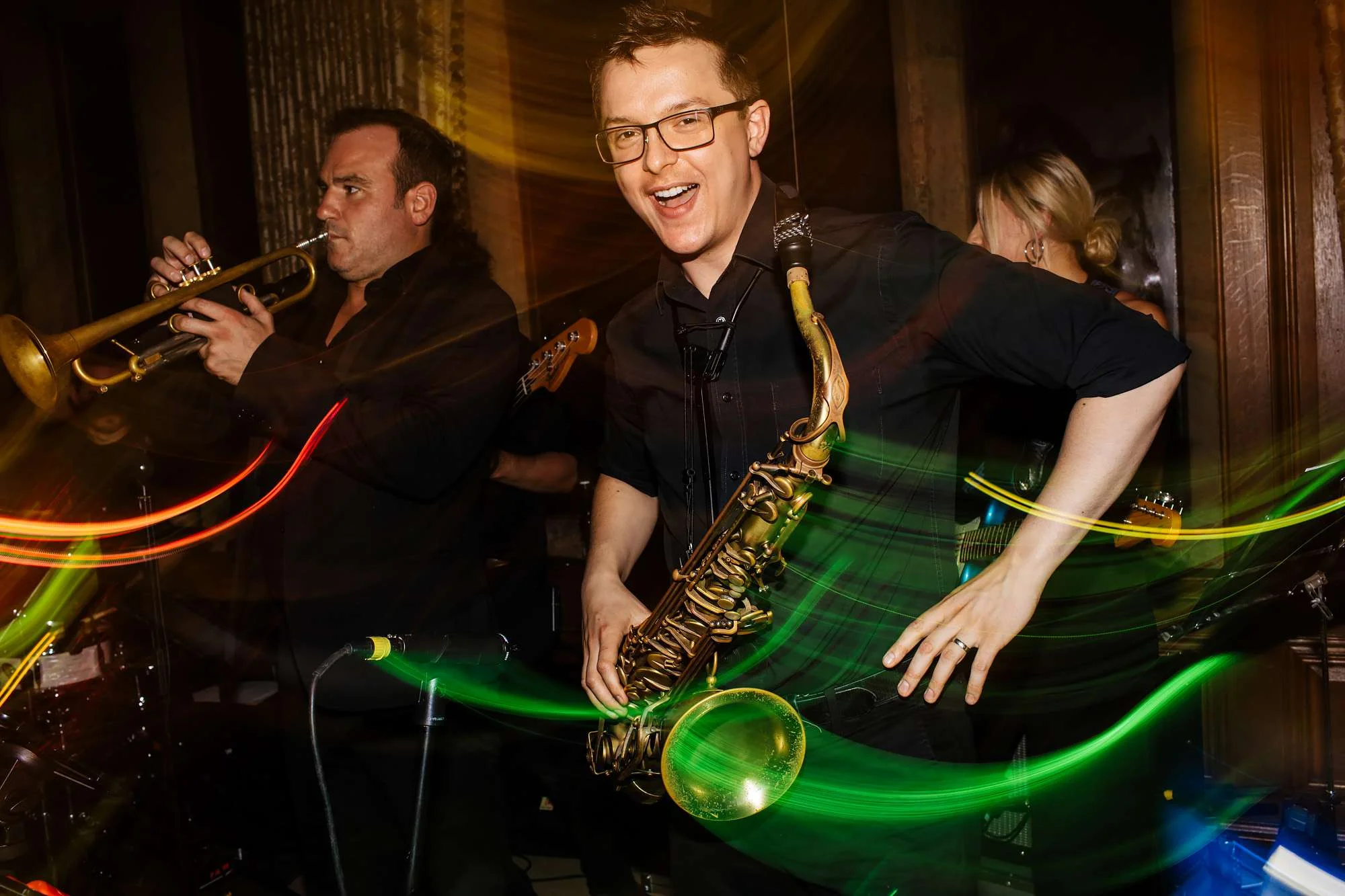 Saxophonist dancing at a wedding