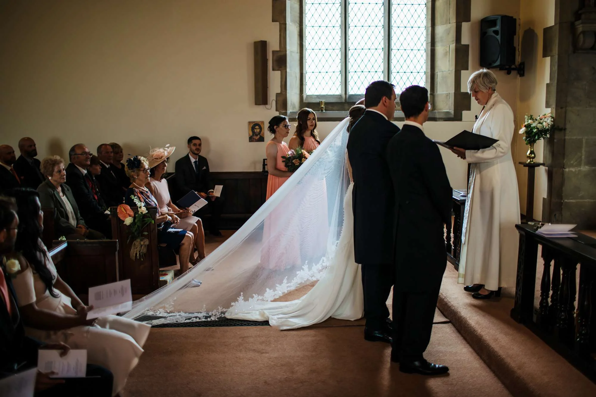 Bride and groom standing at the alter during their wedding