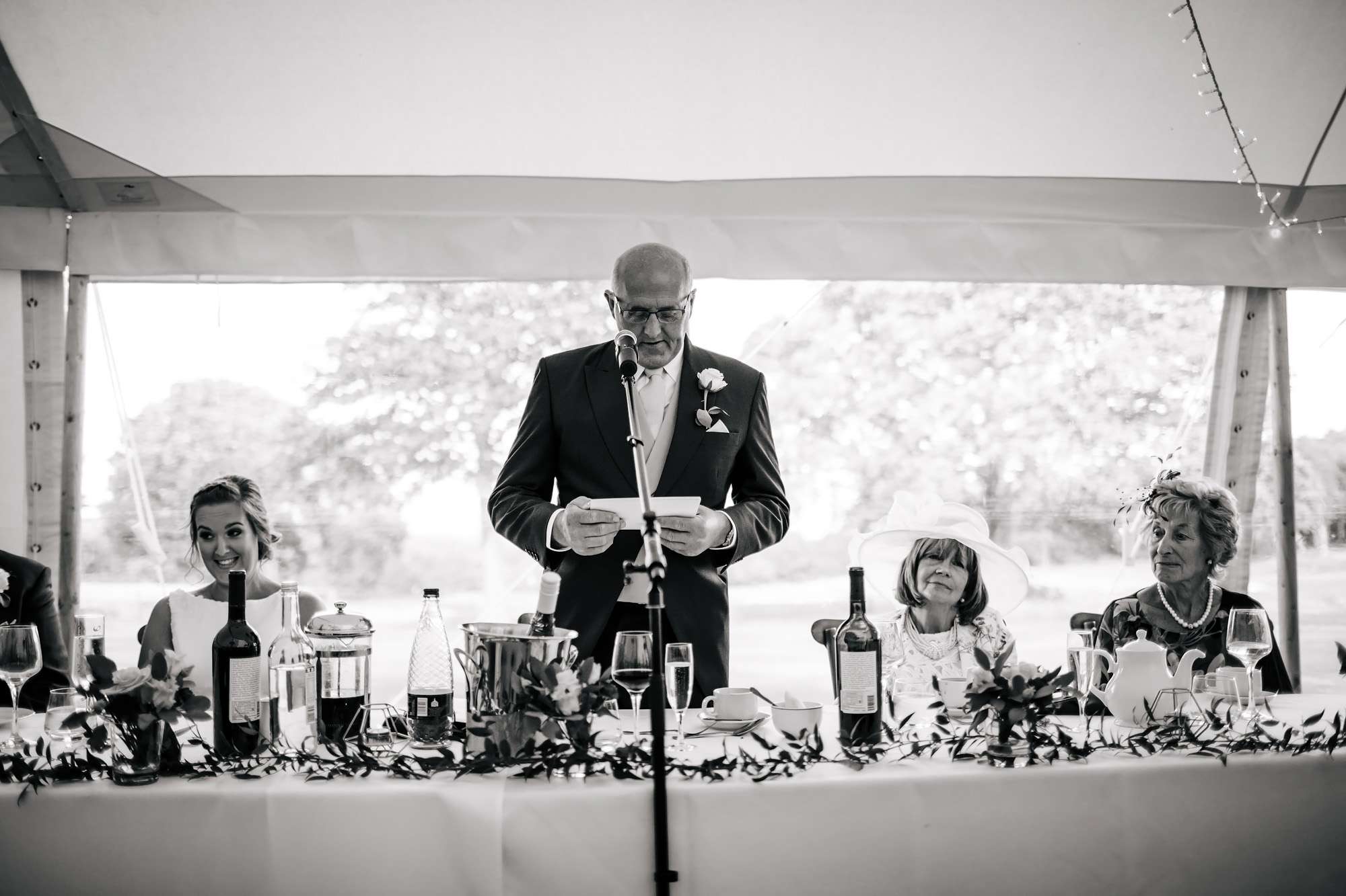 Bride's dad doing mid-speech at a wedding