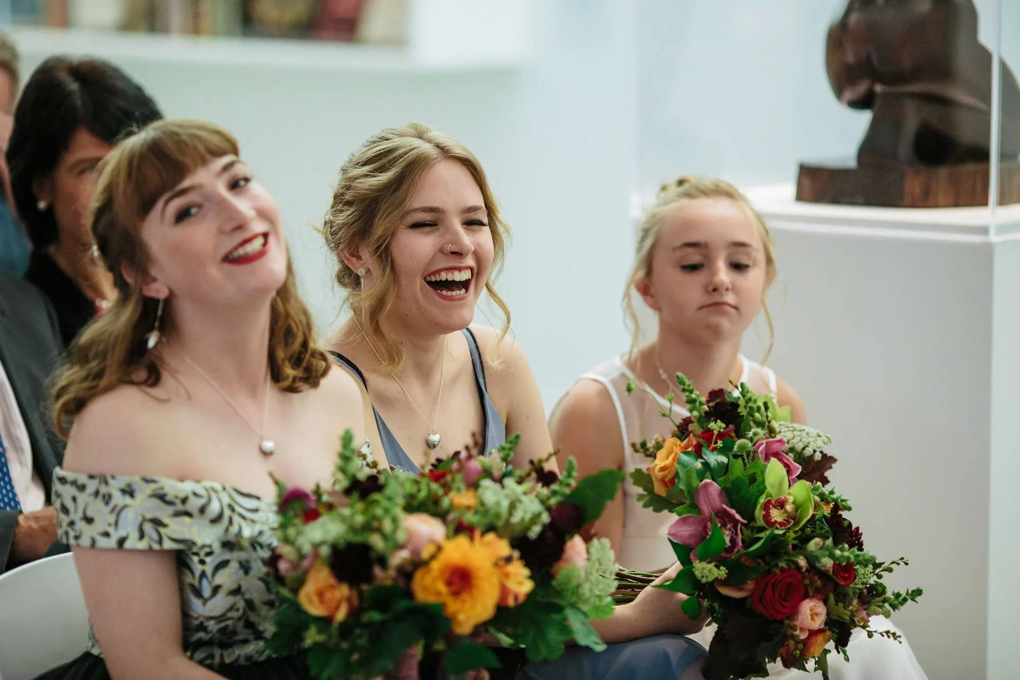 Wedding guests laughing at Hepworth Art Gallery