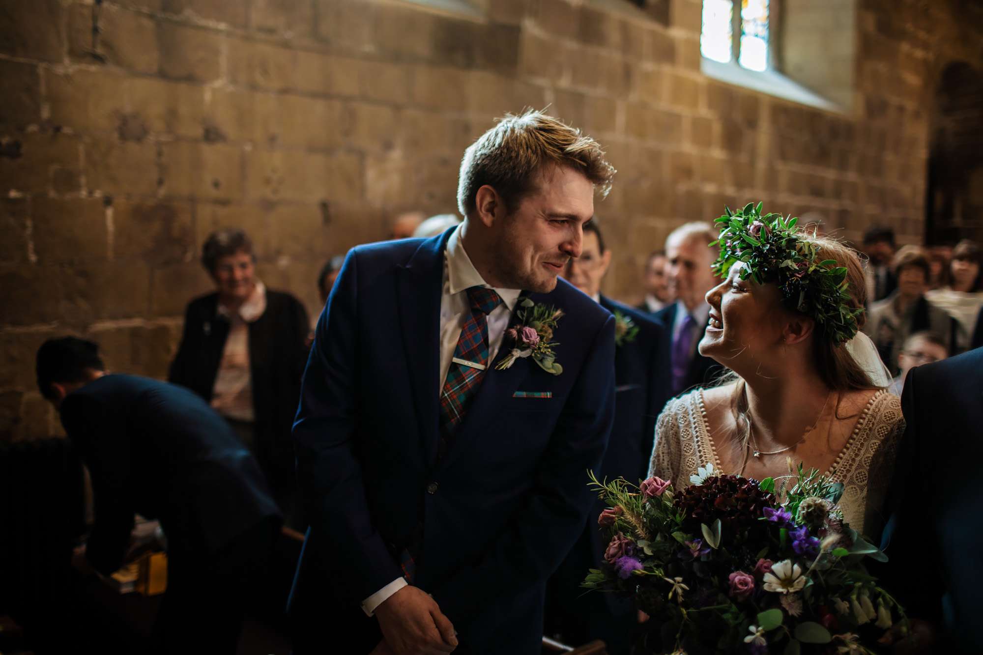 Bride and groom smile at each other on their wedding day