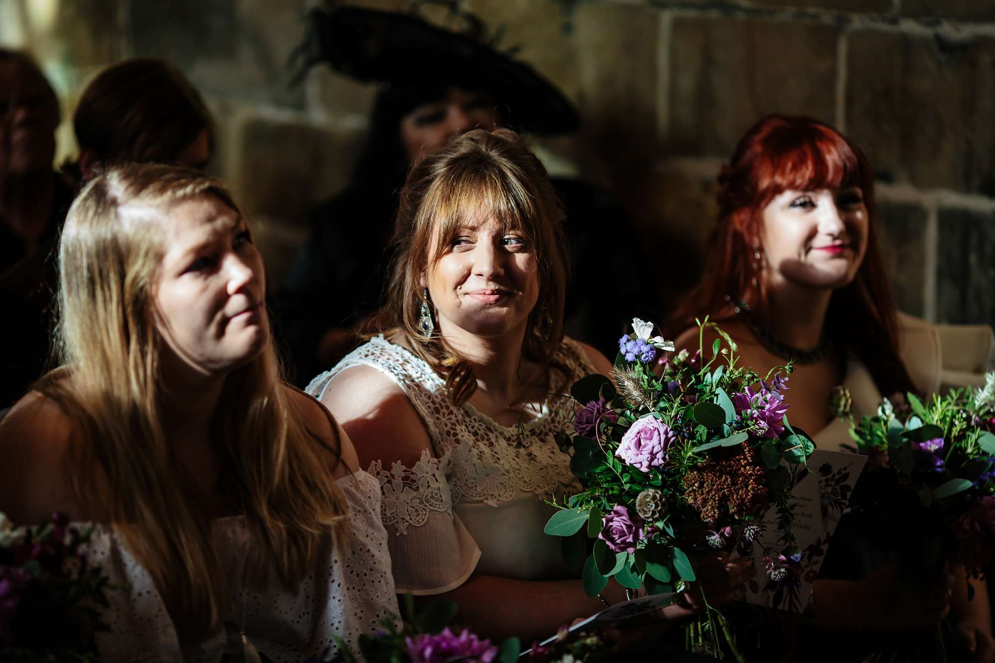 Bridesmaids smiling in the church at a wedding