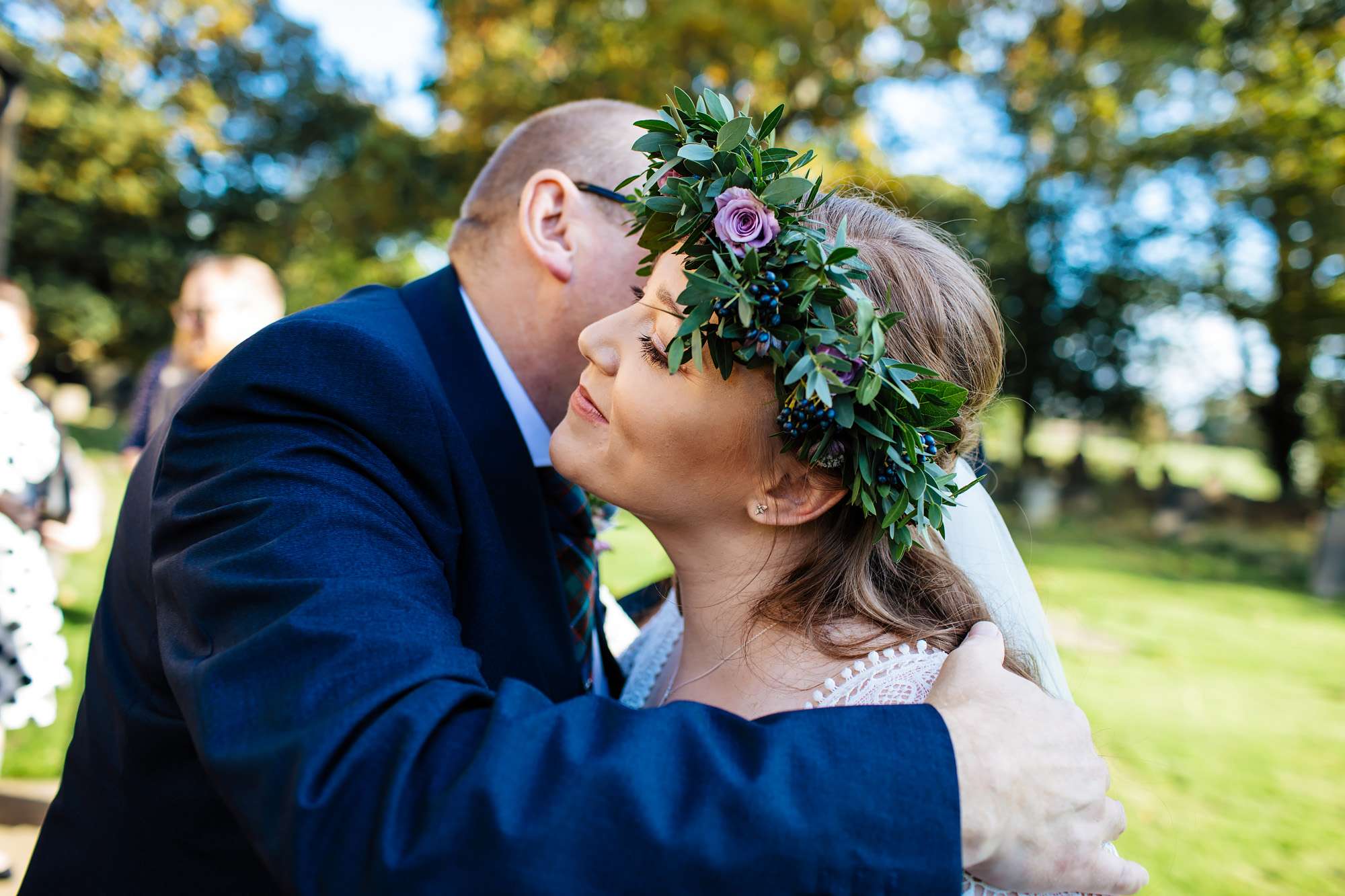 Bride kissing her father on her wedding day