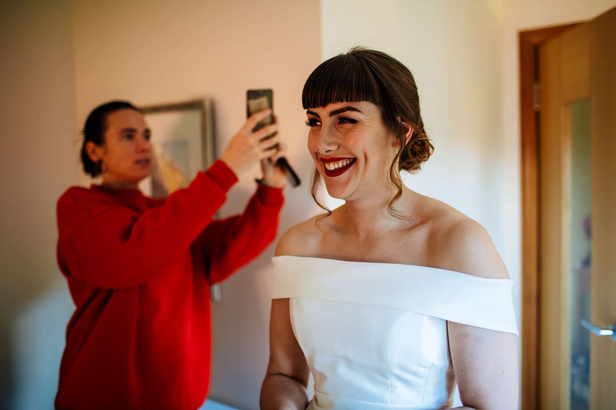 Bride smiling on her wedding day before leaving