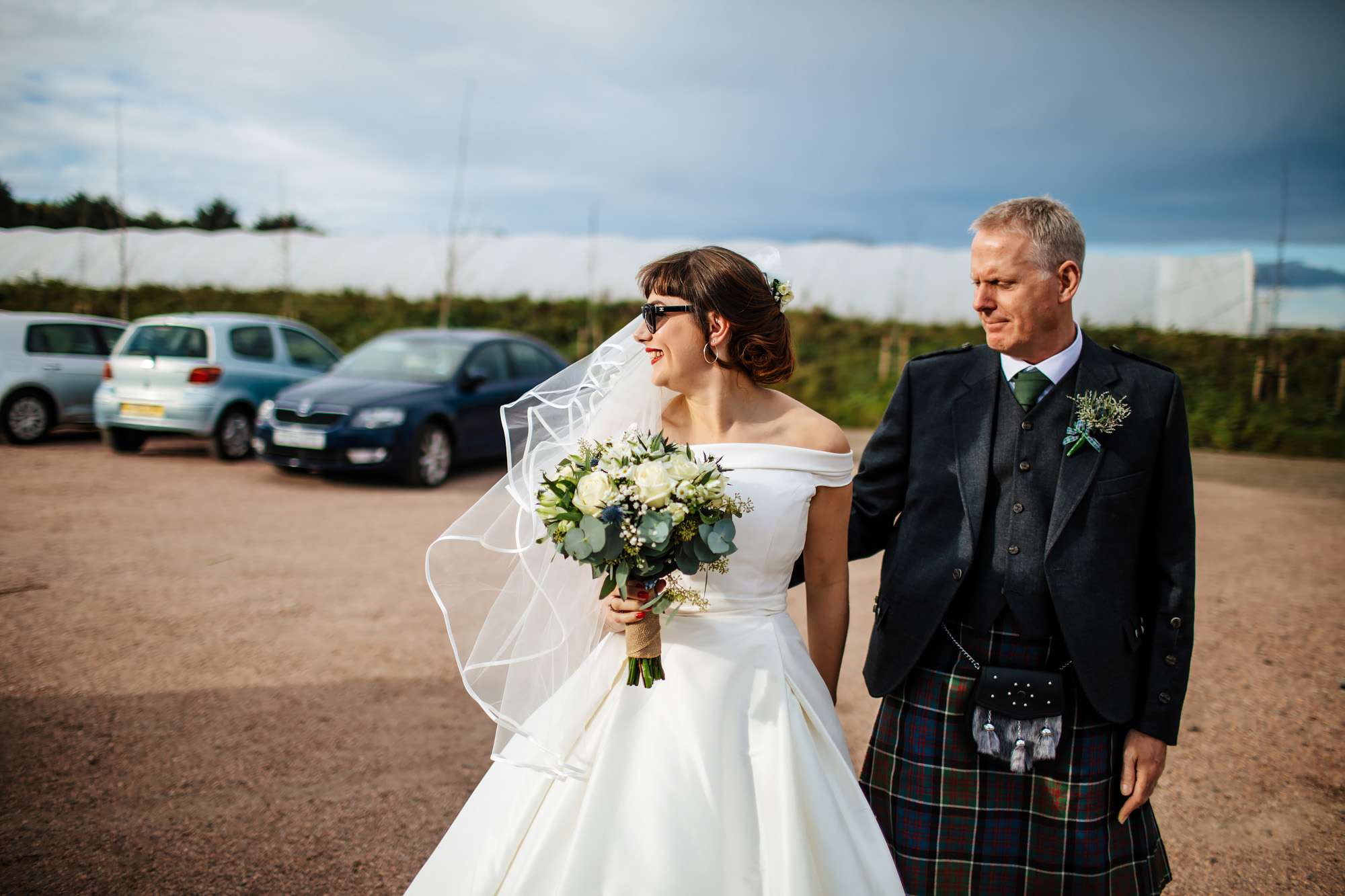 Bride and Dad walking to the wedding venue in Fife