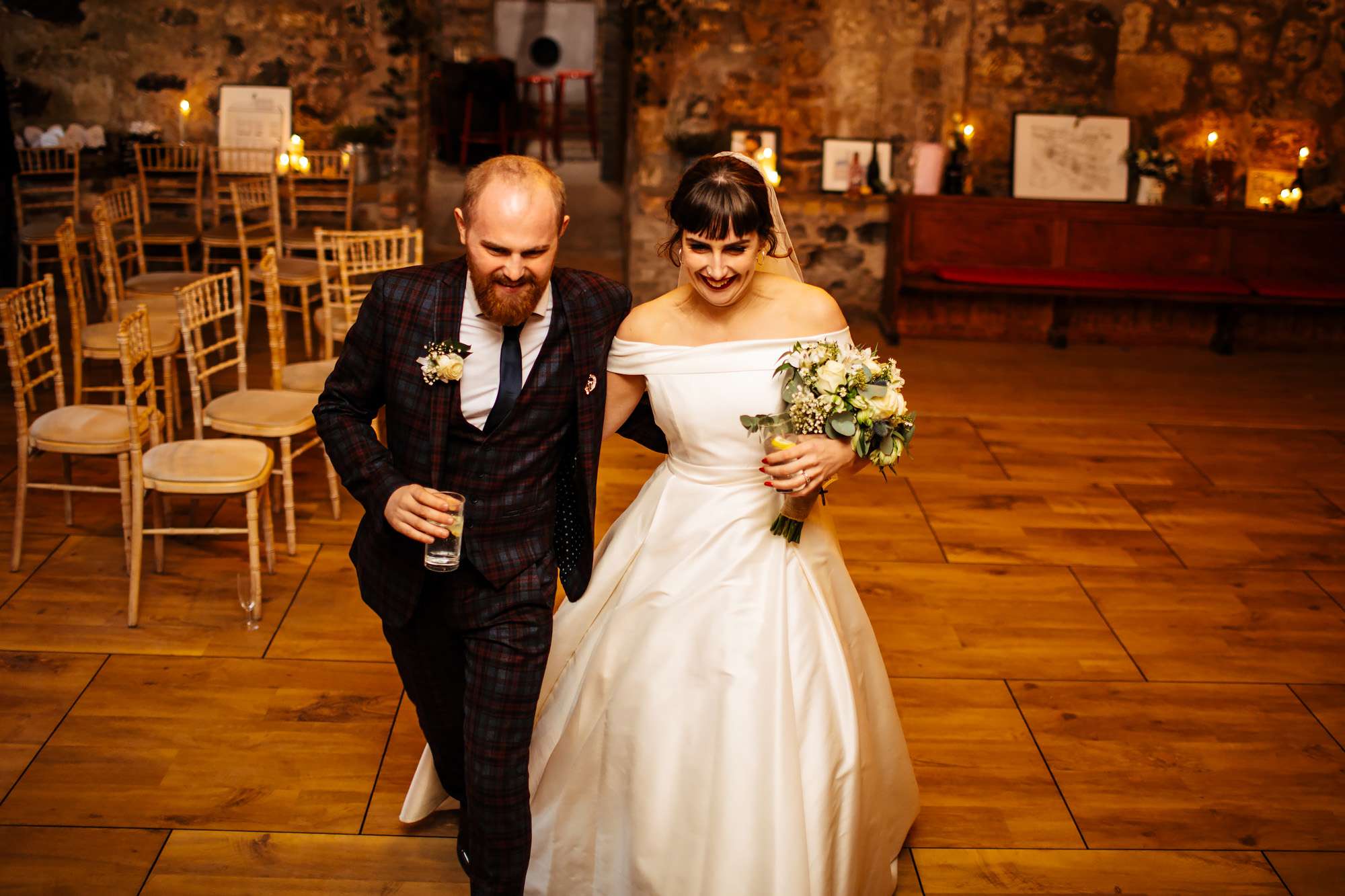 Bride and groom enter the wedding breakfast at The Rhynd Leuchars