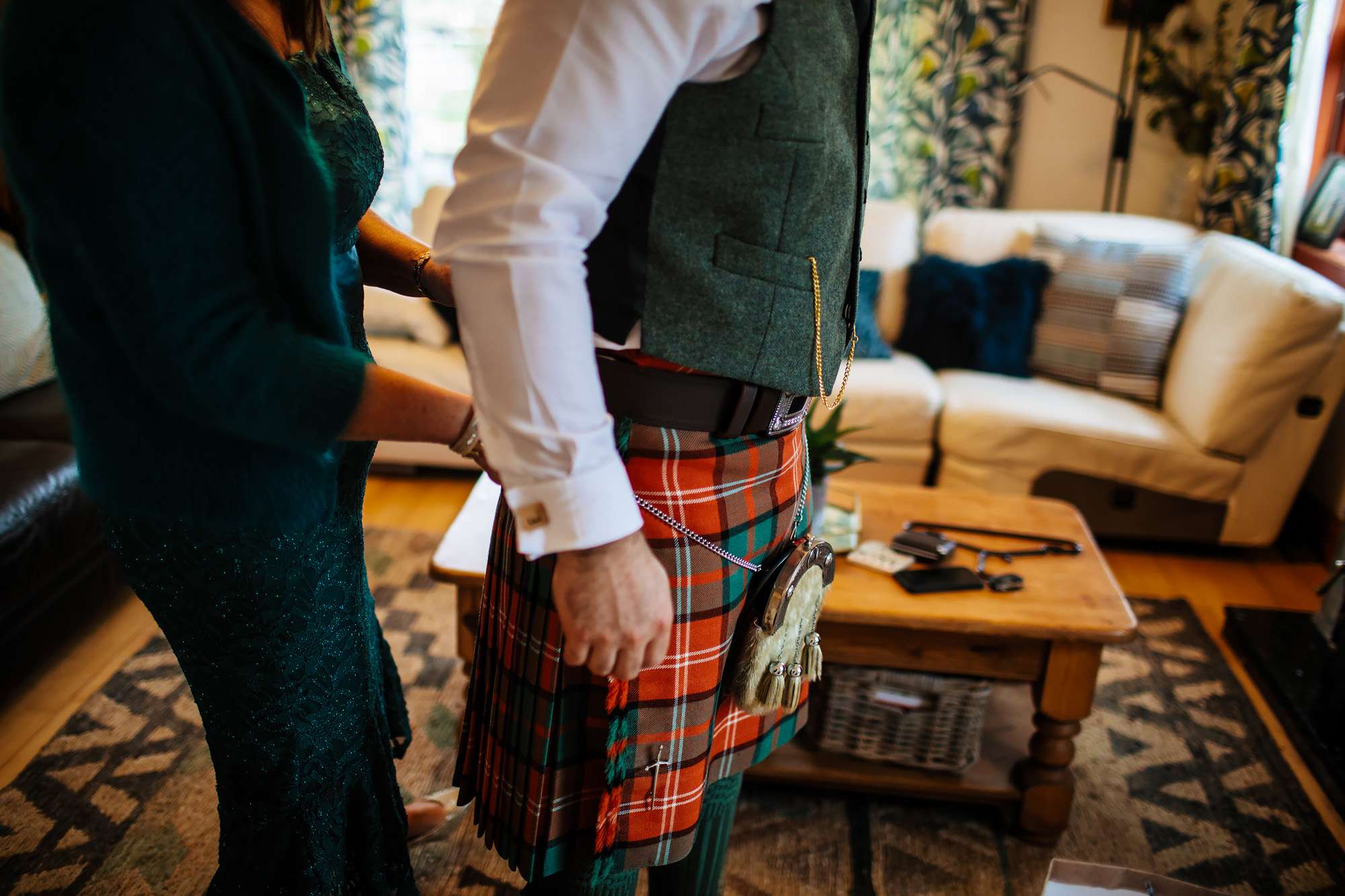 Groom getting into his kilt in Crail