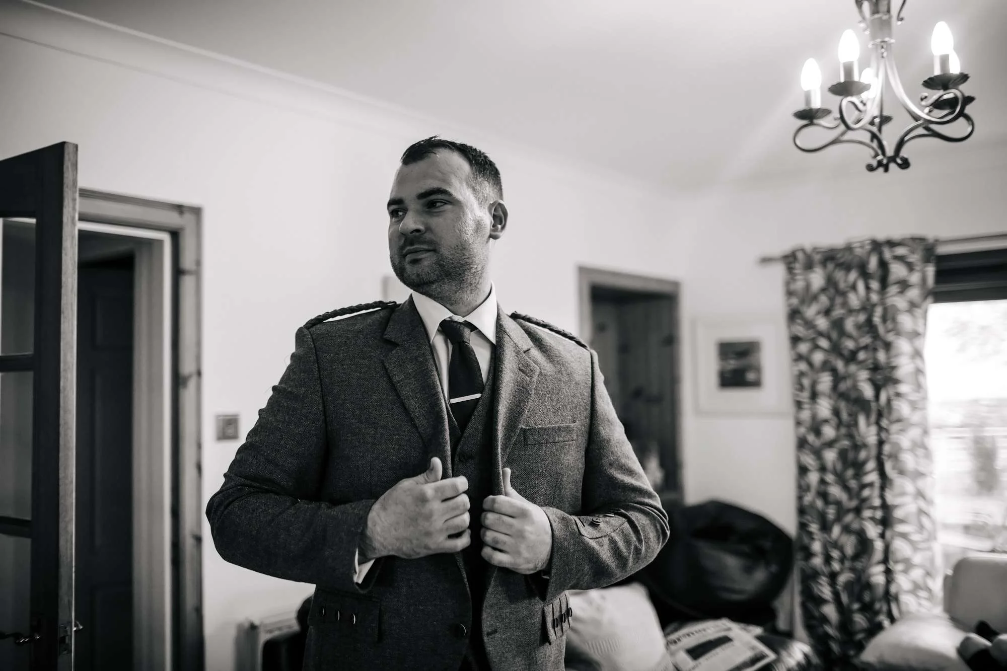 Groom getting dressed for his wedding
