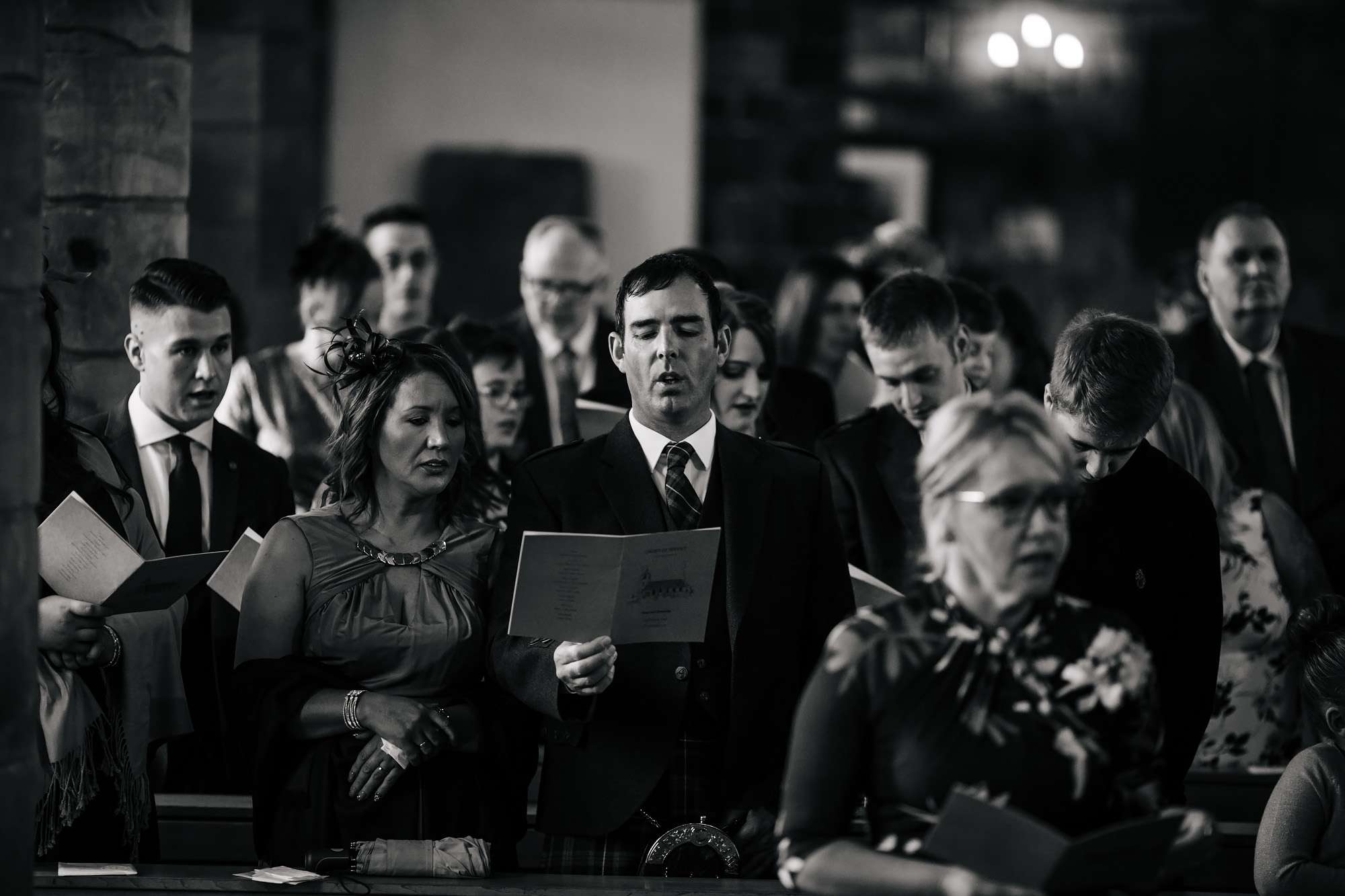 Wedding guests singing church hymns