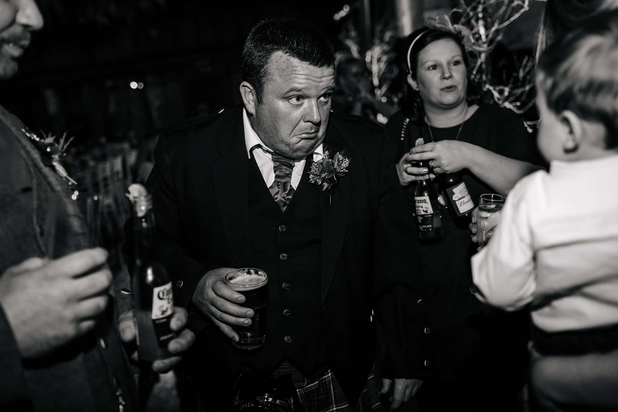 Wedding guests pulling faces in Crail