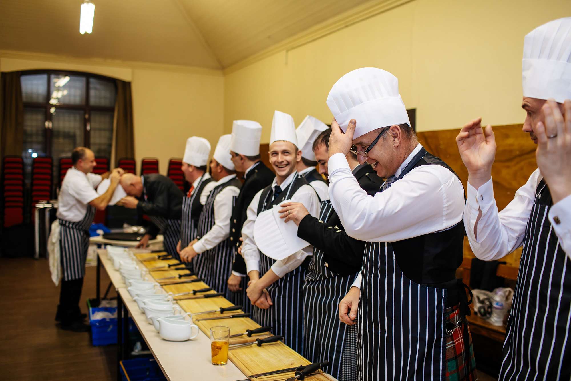 Wedding guests with chefs hats in Scotland