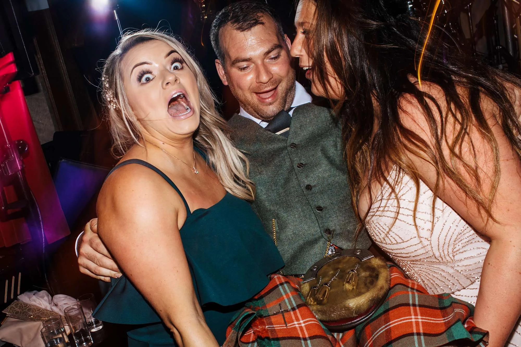 Funny faces at a Scottish wedding