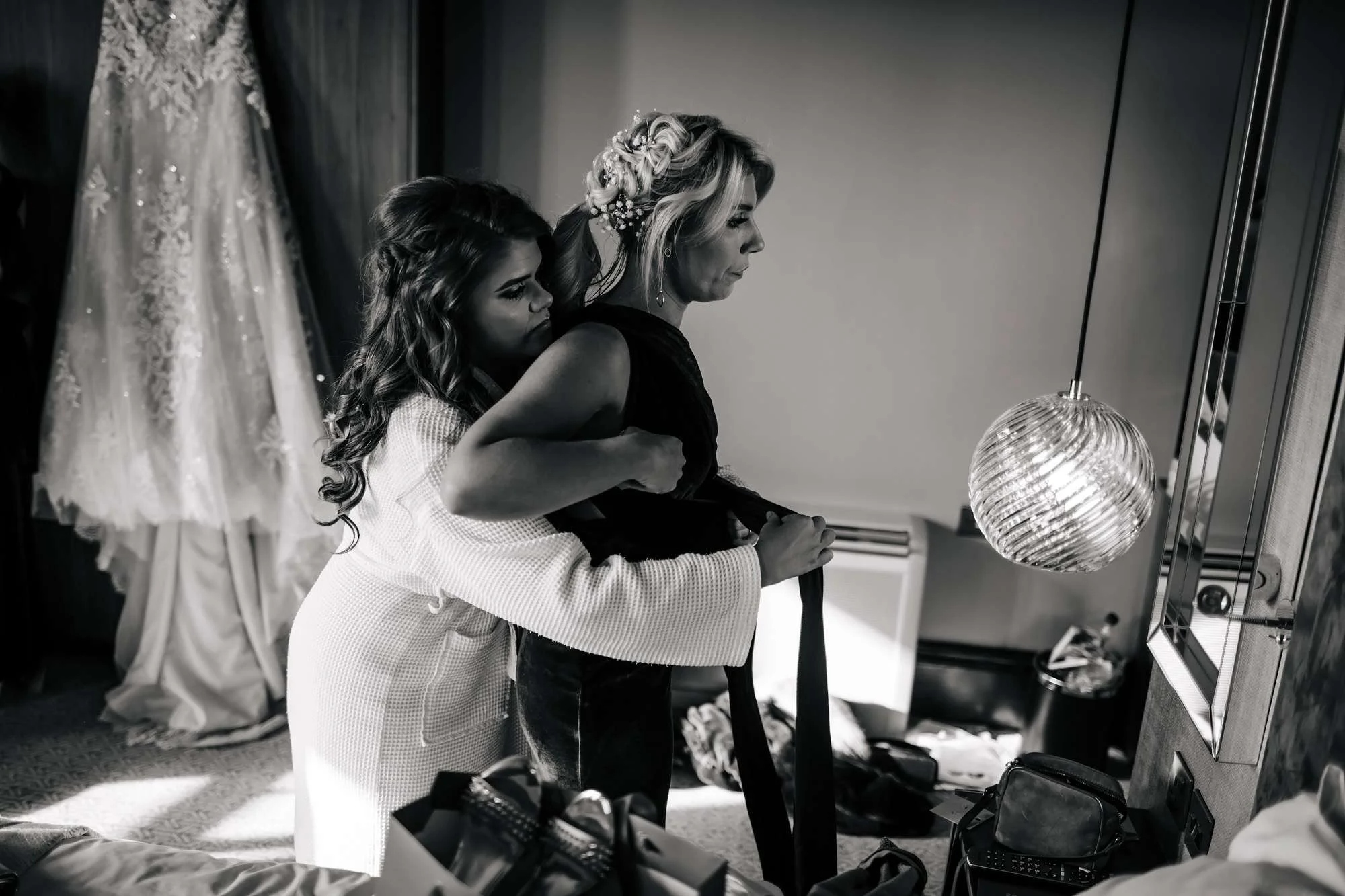 Bridesmaid getting dressed on wedding day in Blackpool