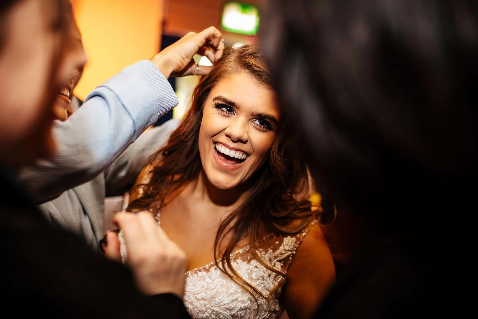 Bride laughing with wedding guests