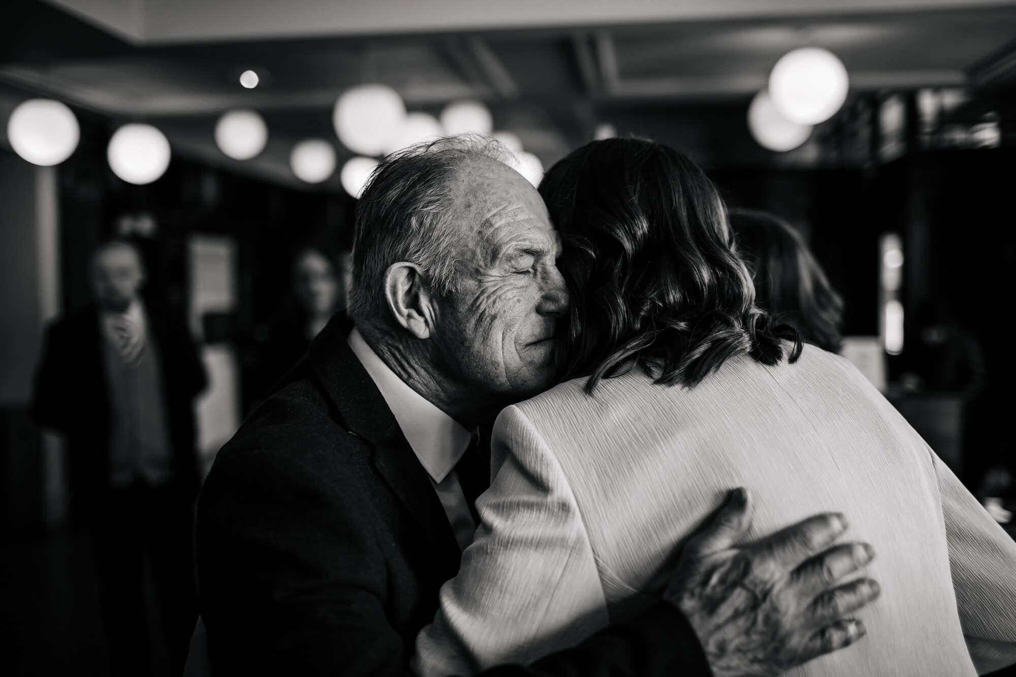 Bride and dad hug at a Yorkshire wedding