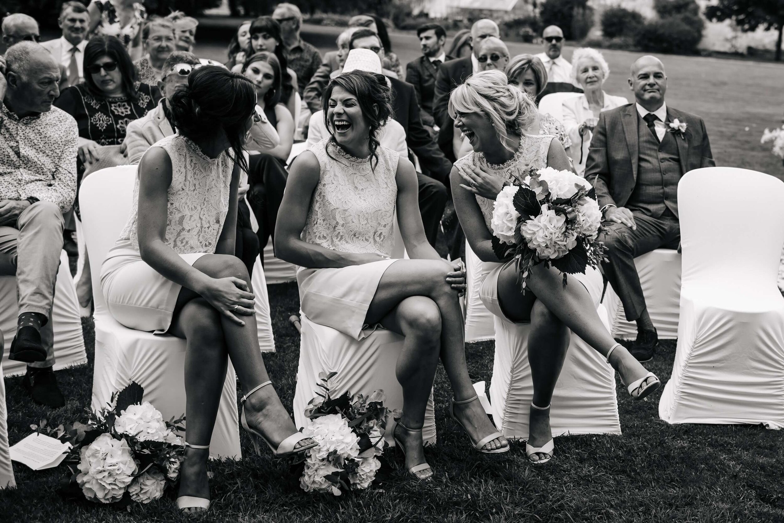 Bridesmaids laughing at the wedding ceremony in Yorkshire