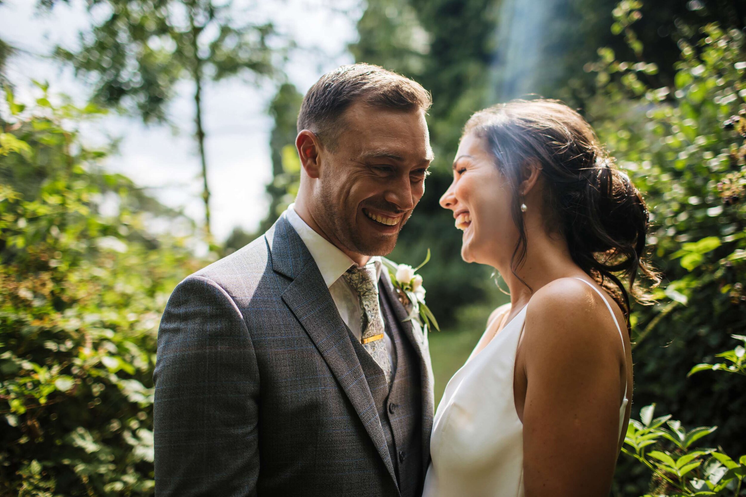 Bride and groom laughing at their Solberge Hall wedding
