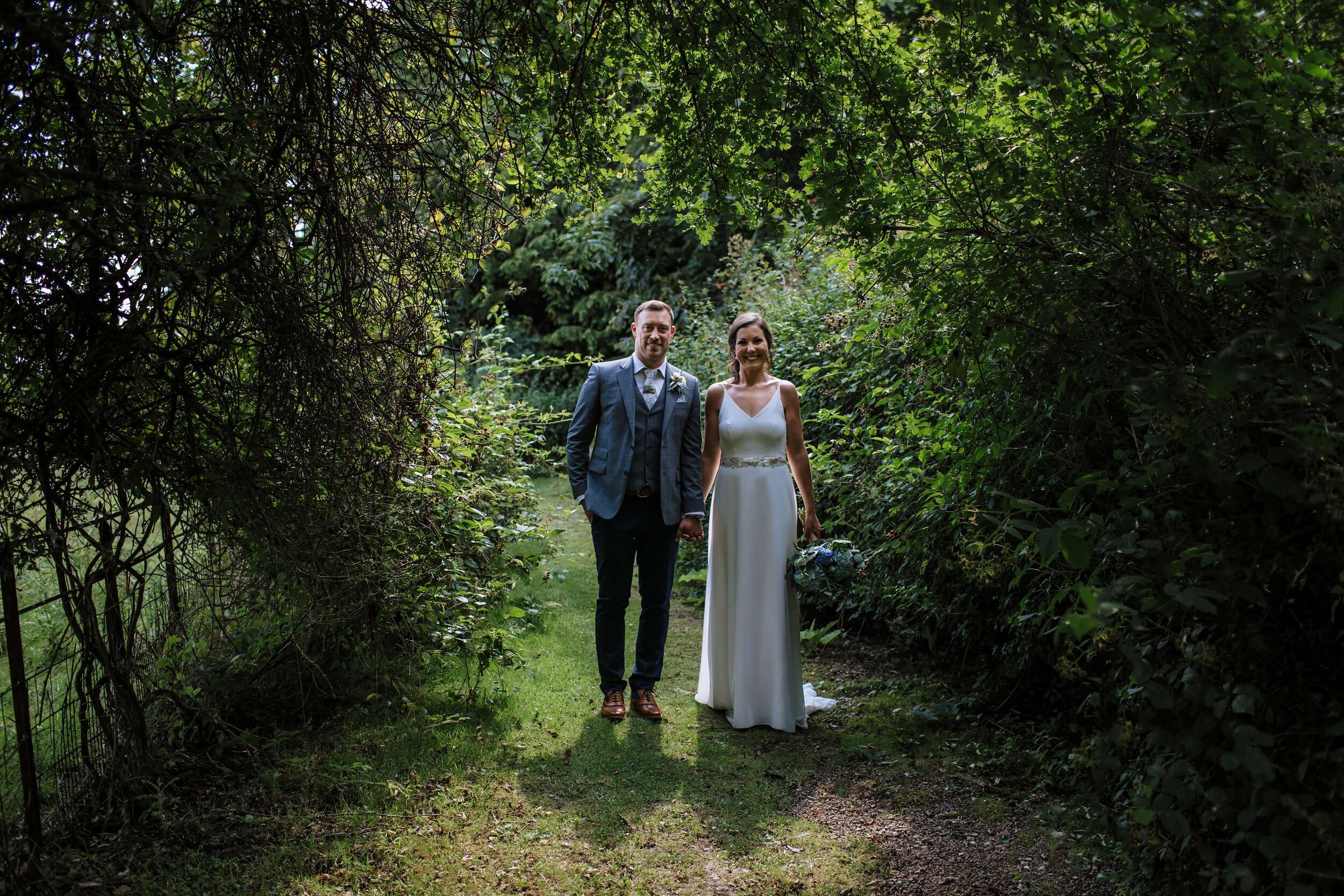 Bride and groom posing at their Solberge Hall wedding