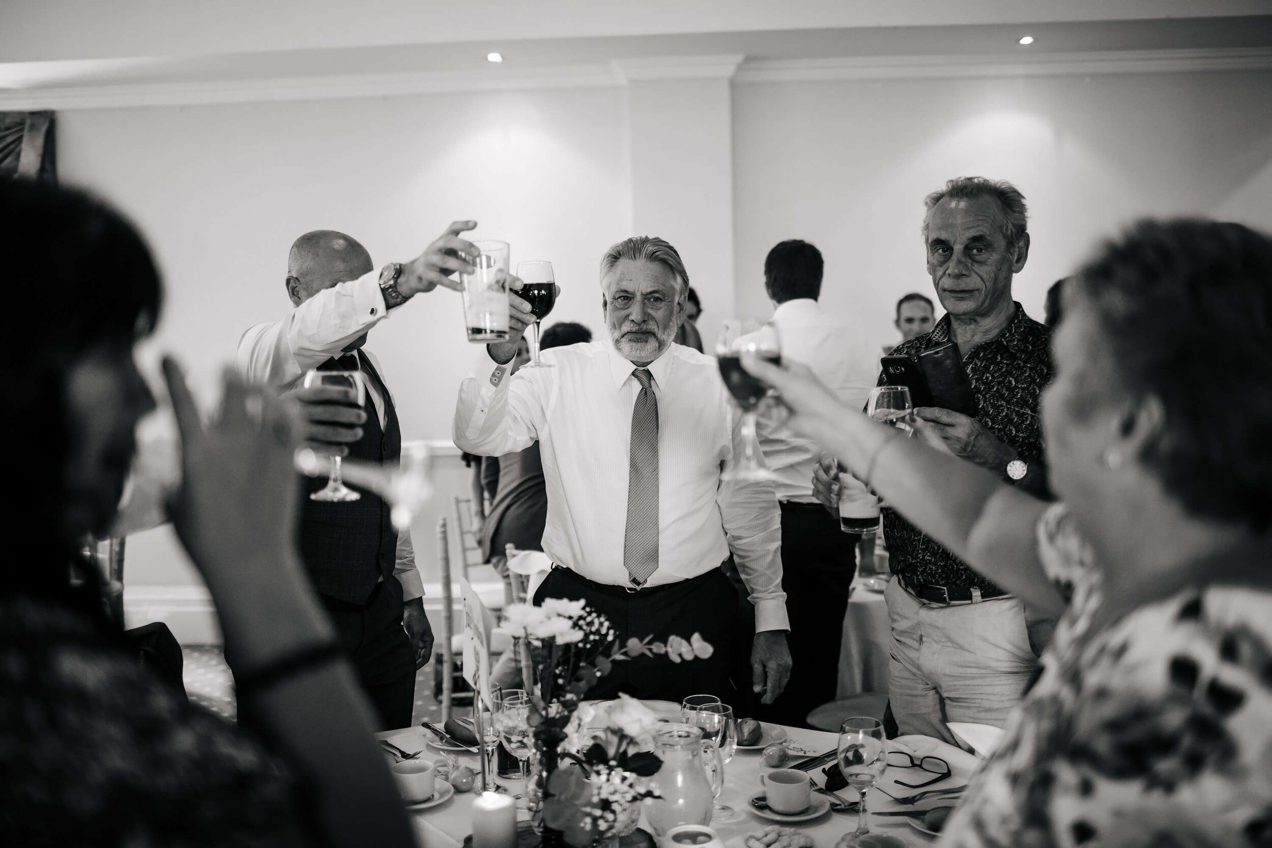 Guests toasting drinks at a Solberge Hall wedding