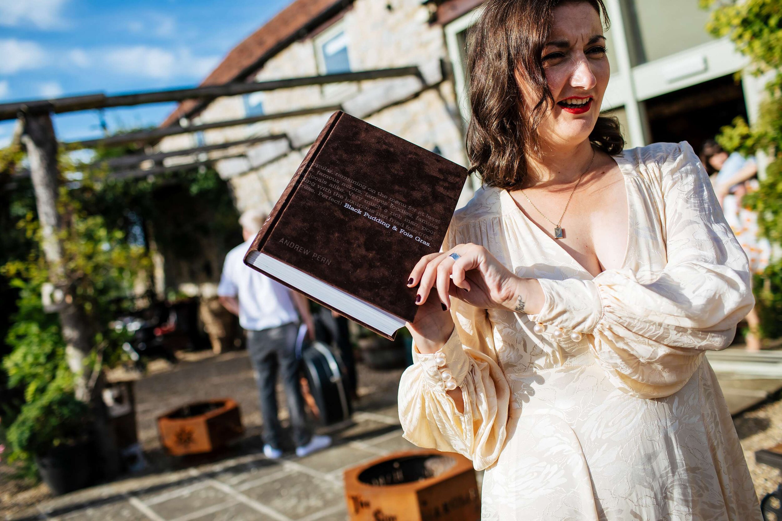 Bride with her guestbook at The Star Inn Harome