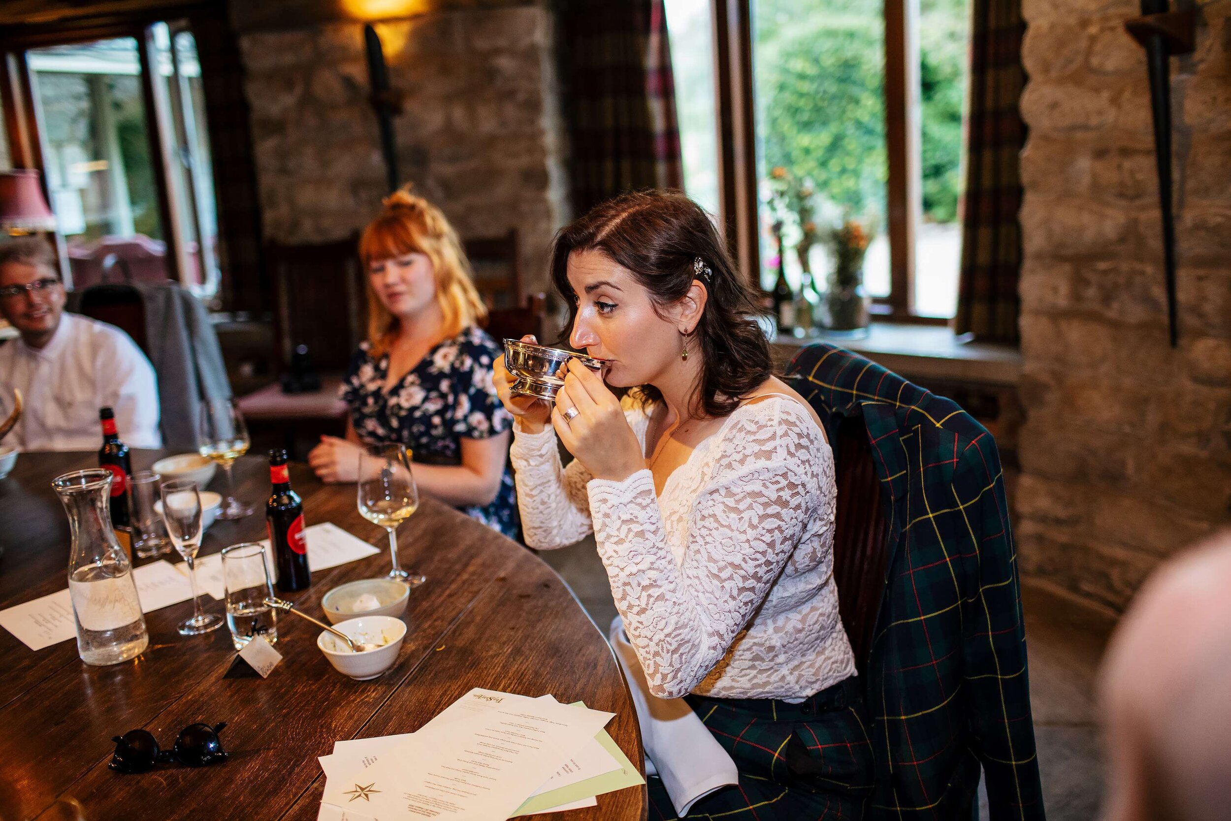 Bride drinks from a quaich at The Star Inn Harome