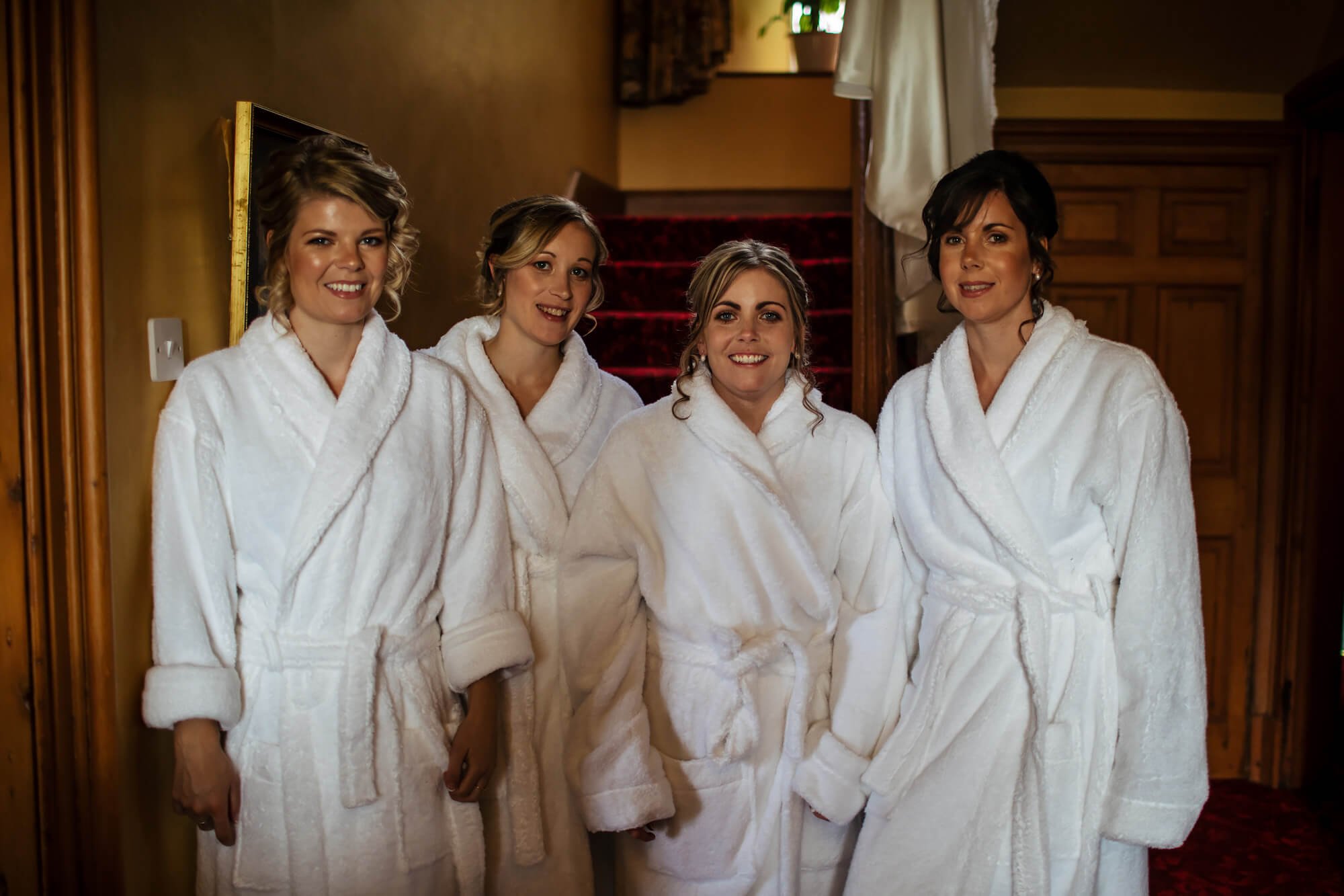 Bridesmaids in their dressing gowns before the wedding