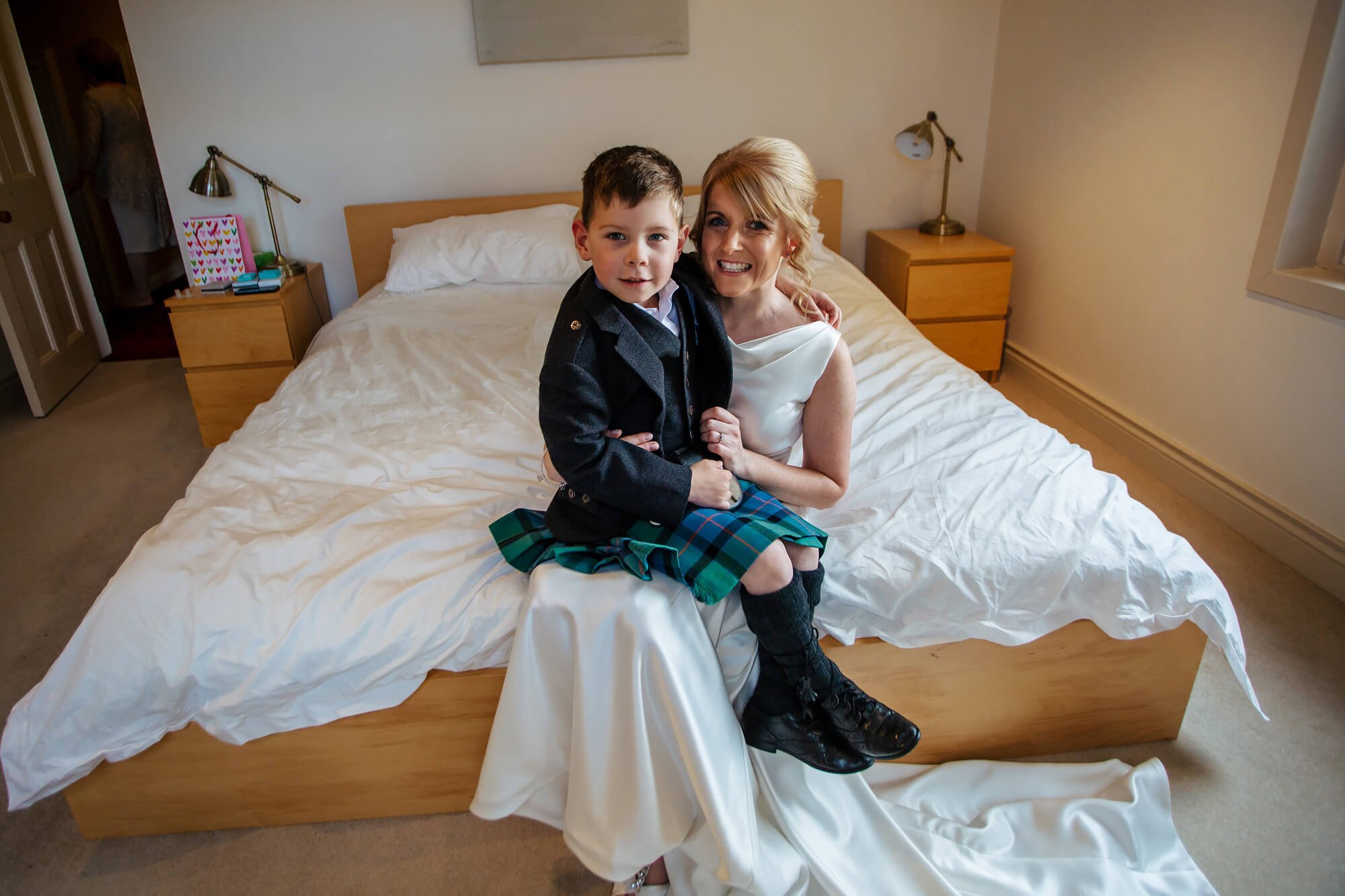 Bride and small boy portrait in a kilt 