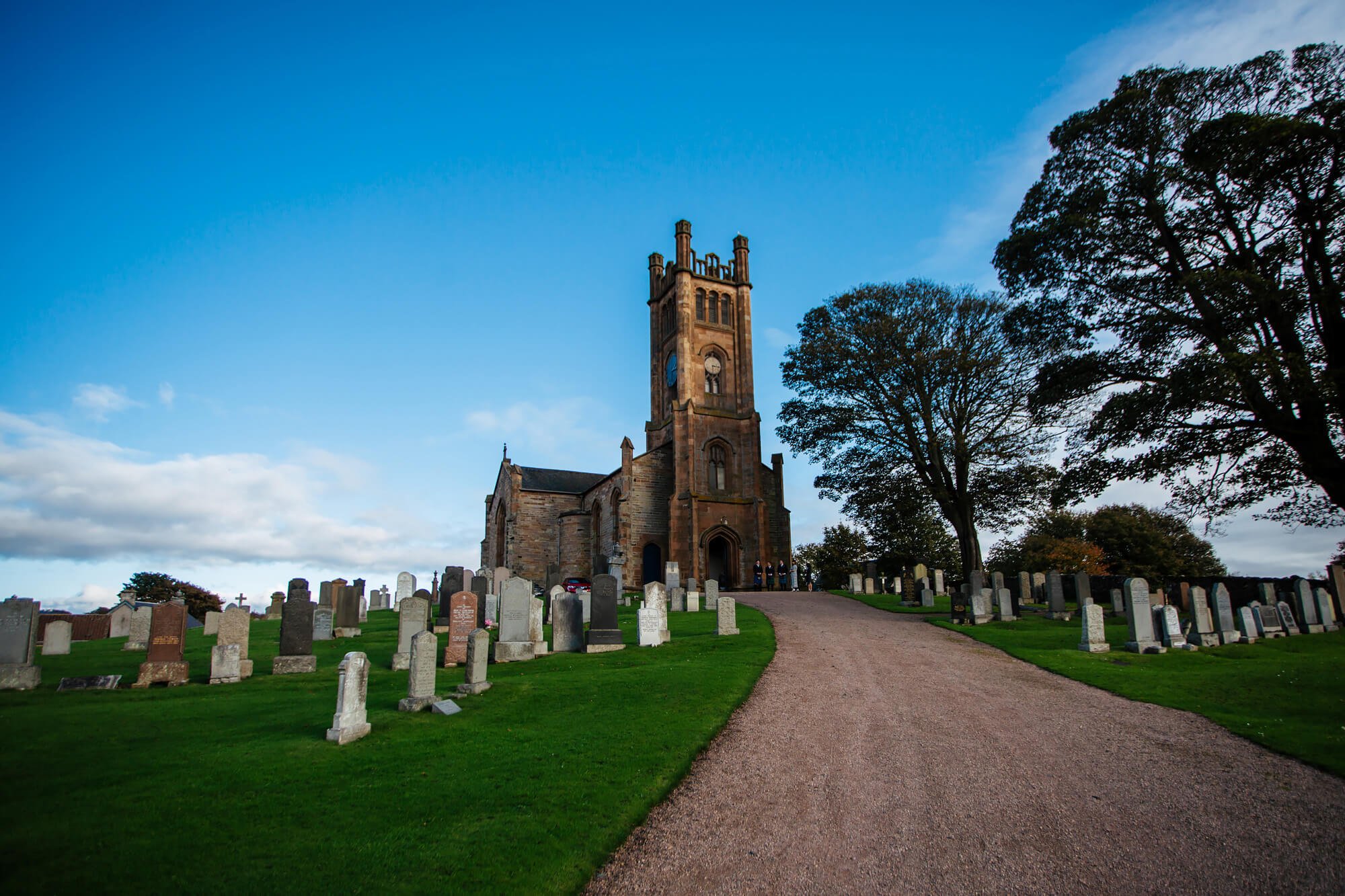 Sunny churchyard for a Scottish wedding