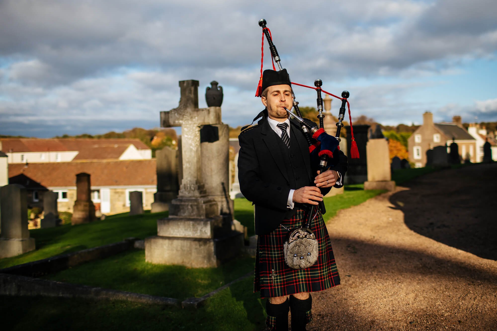 Piper playing at a Scottish farm wedding