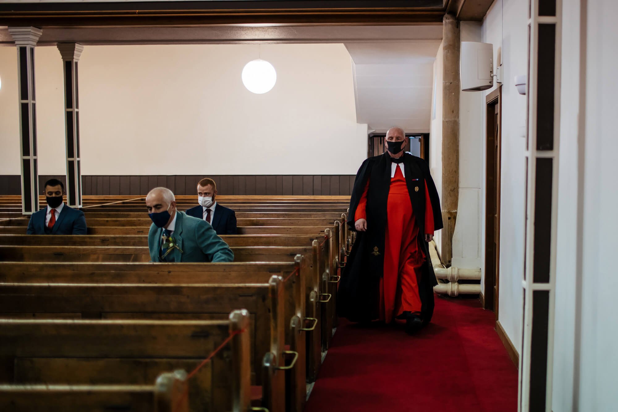 Vicar enters the church before the wedding ceremony