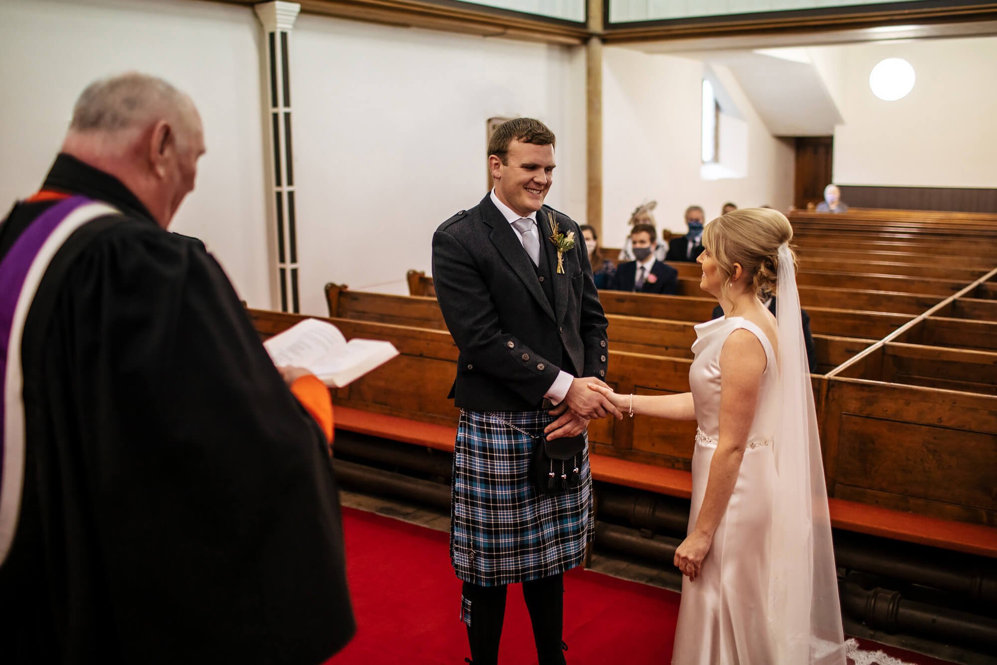 Bride and groom saying I Do at their wedding ceremony