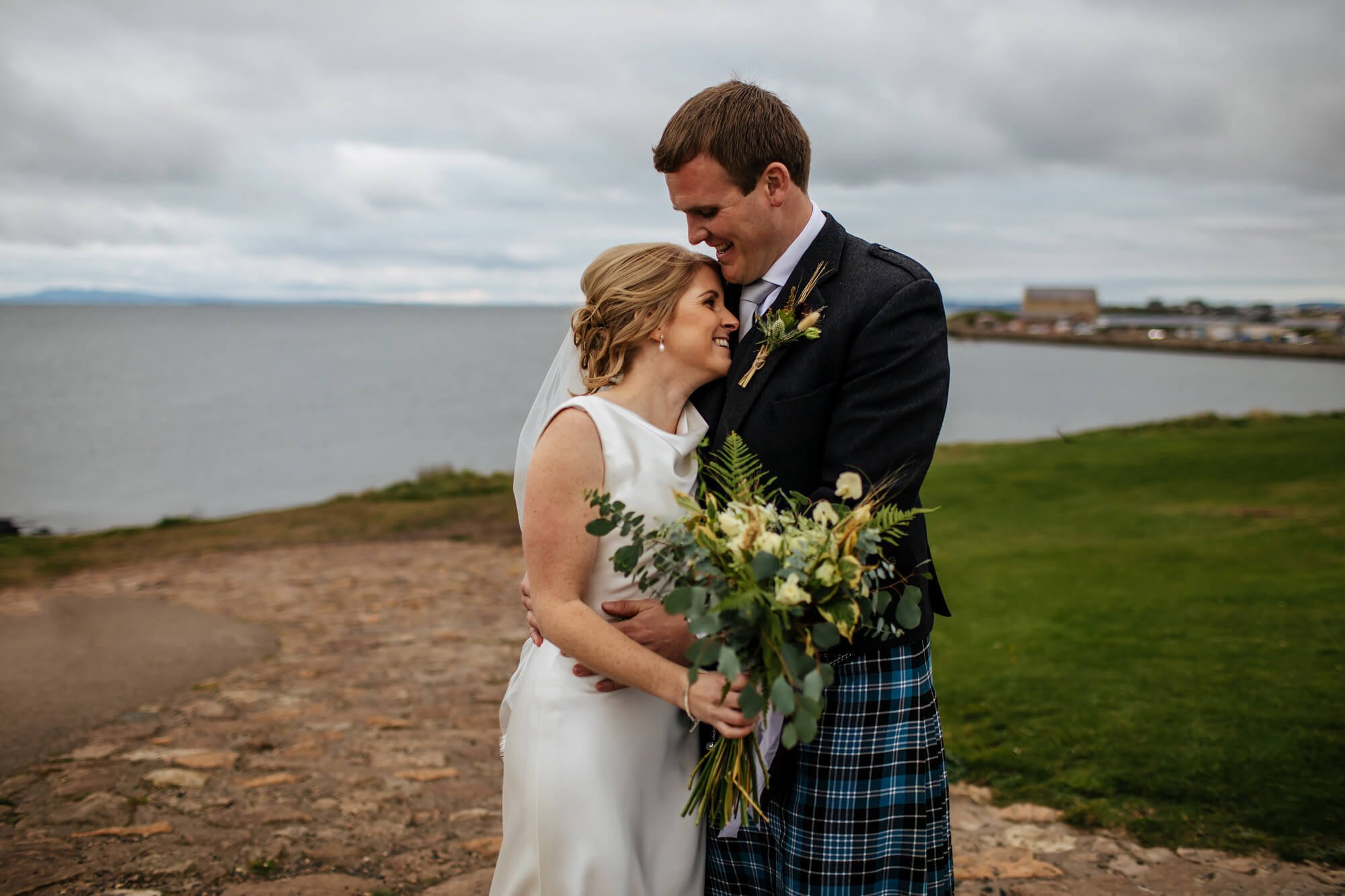 Bride and groom portrait on Fife coastal path