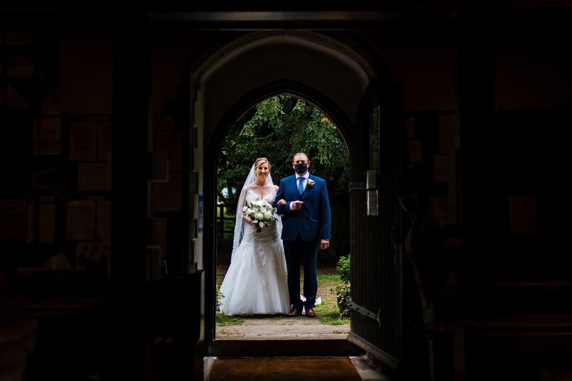 Bride and dad wait outside the church in Kent