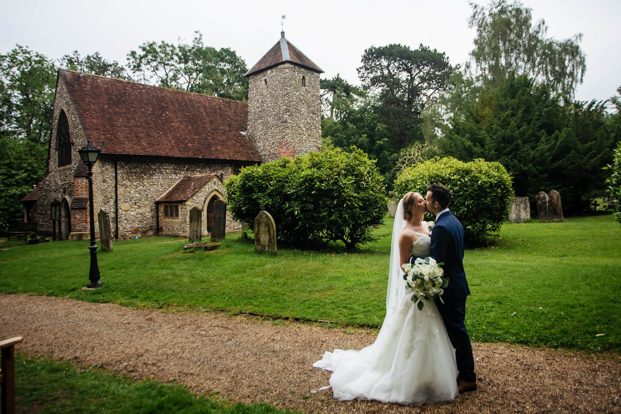 Bride and groom kiss on their wedding day in Kent