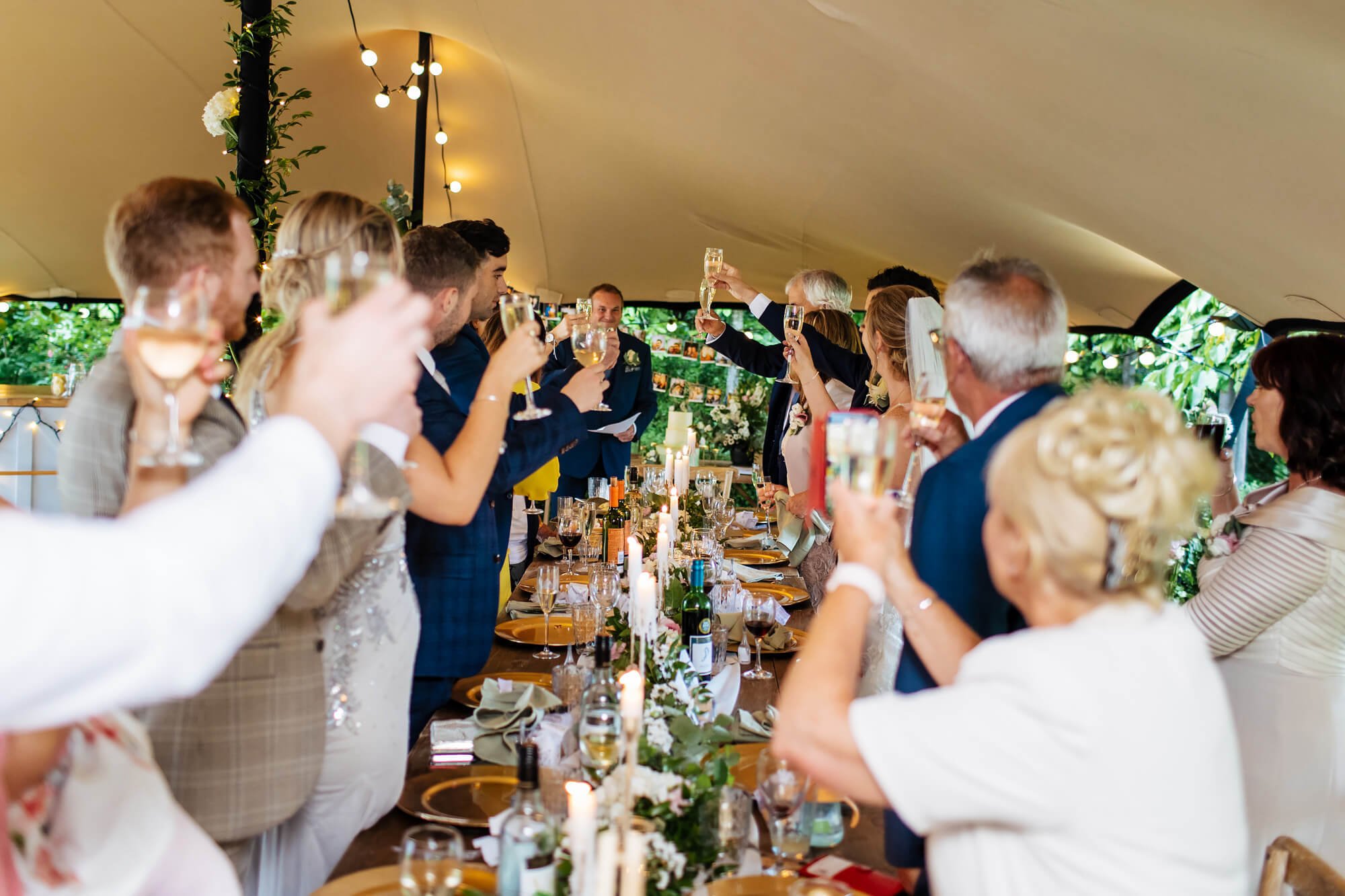 Wedding guests toasting the speech in Kent