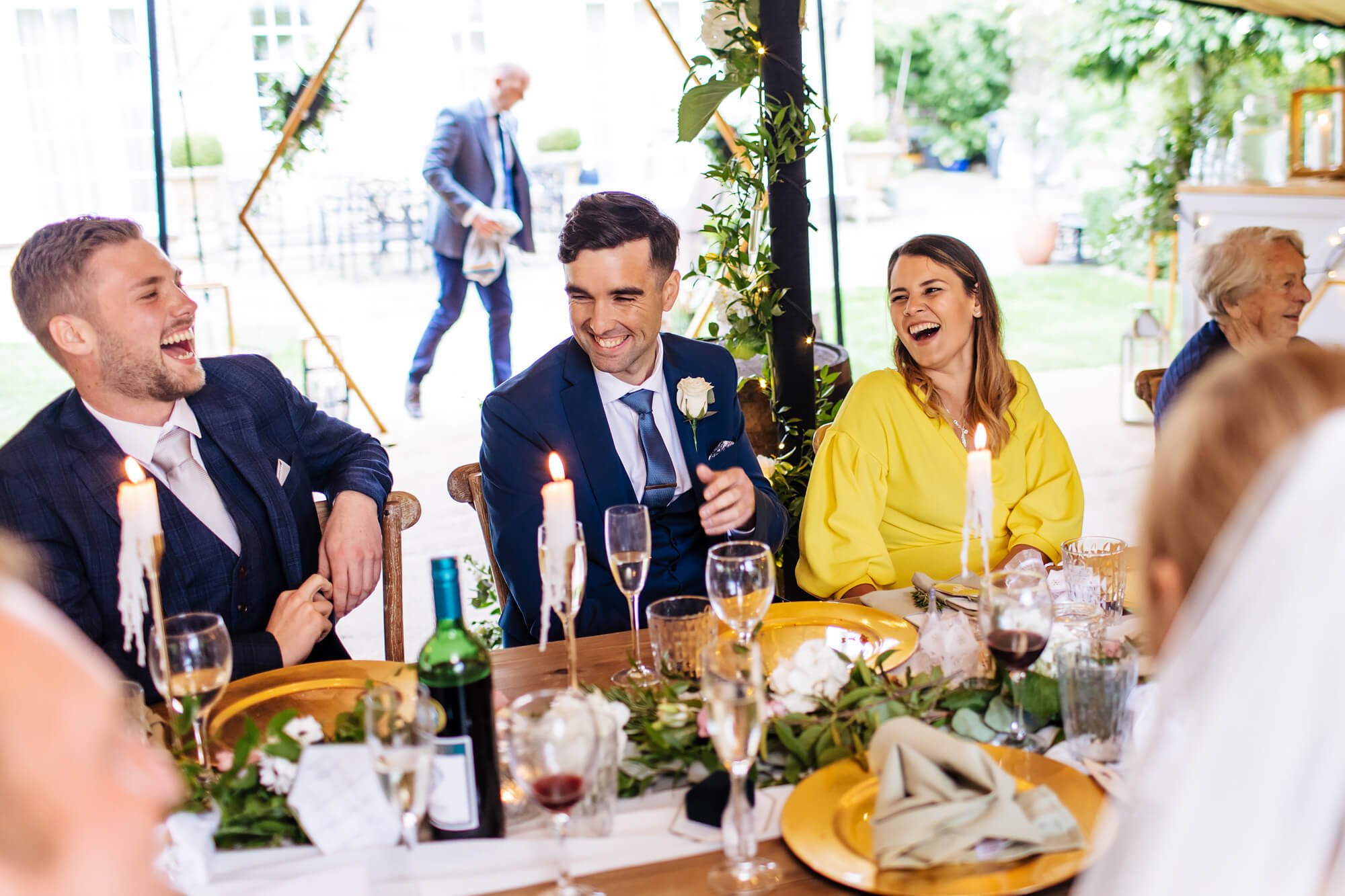 Wedding guests laughing during their meal