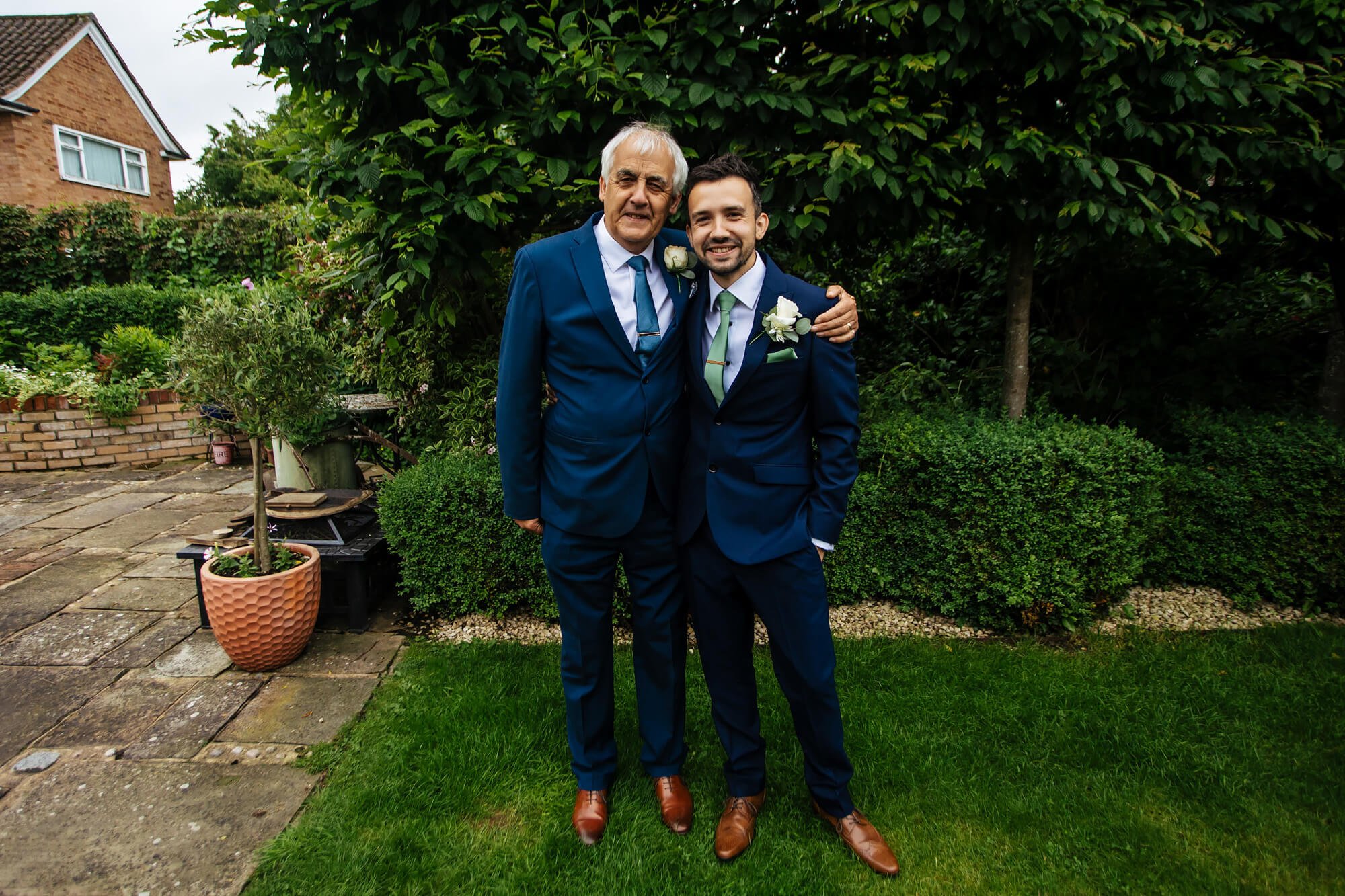 Wedding portrait of the groom and his dad 