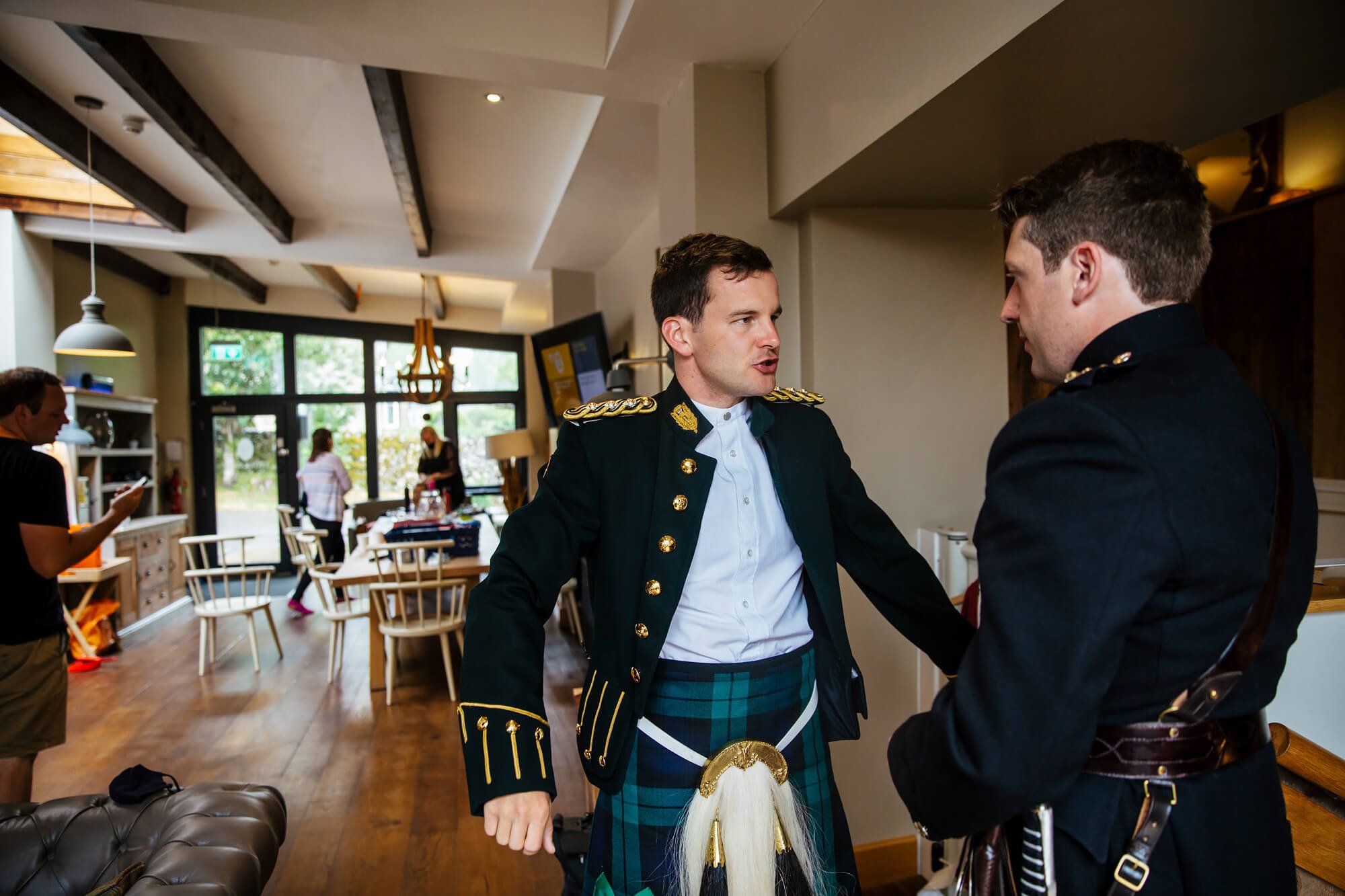 Groom putting his jacket on in Yorkshire