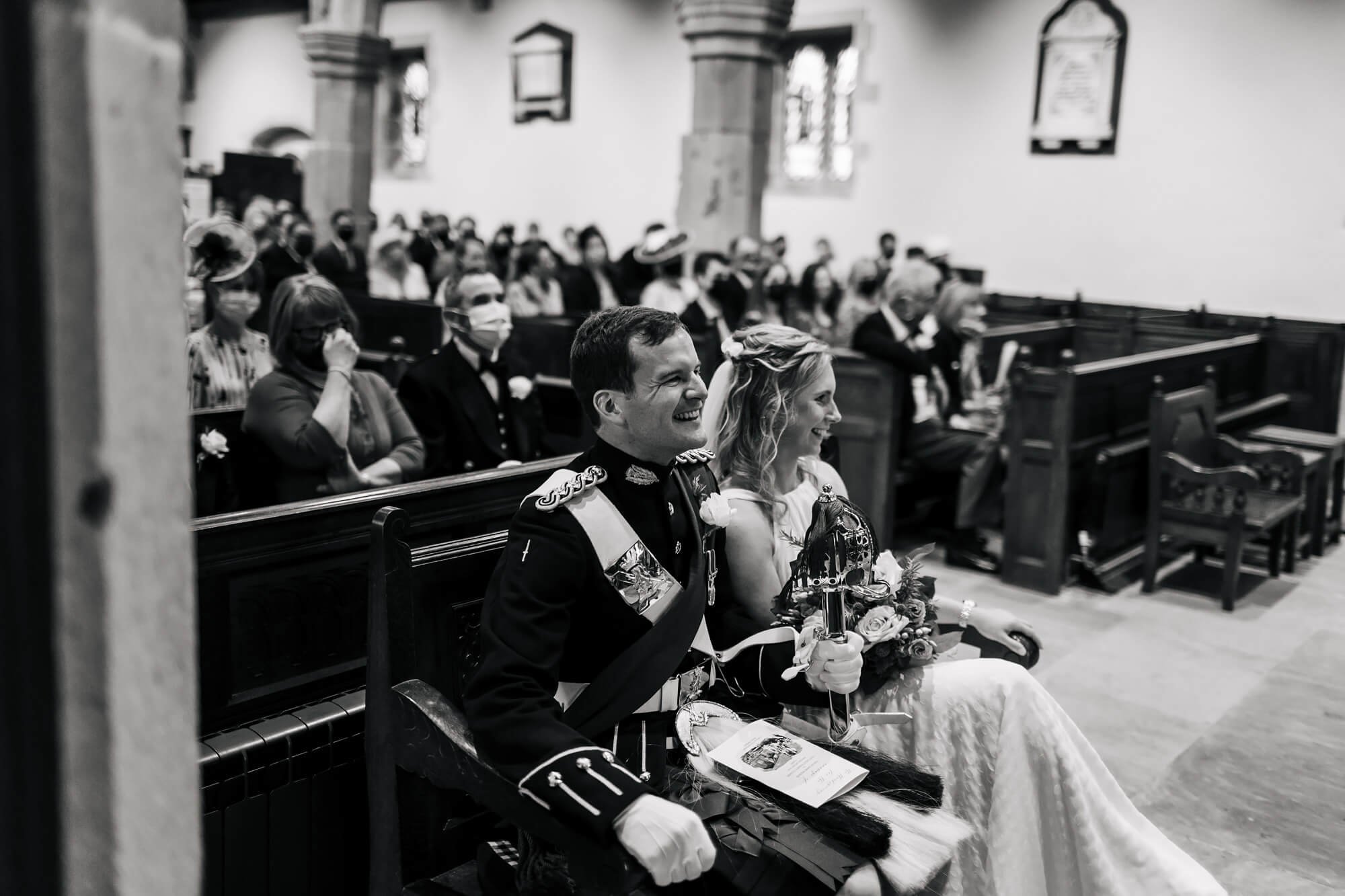 Bride and groom laughing during their wedding ceremony