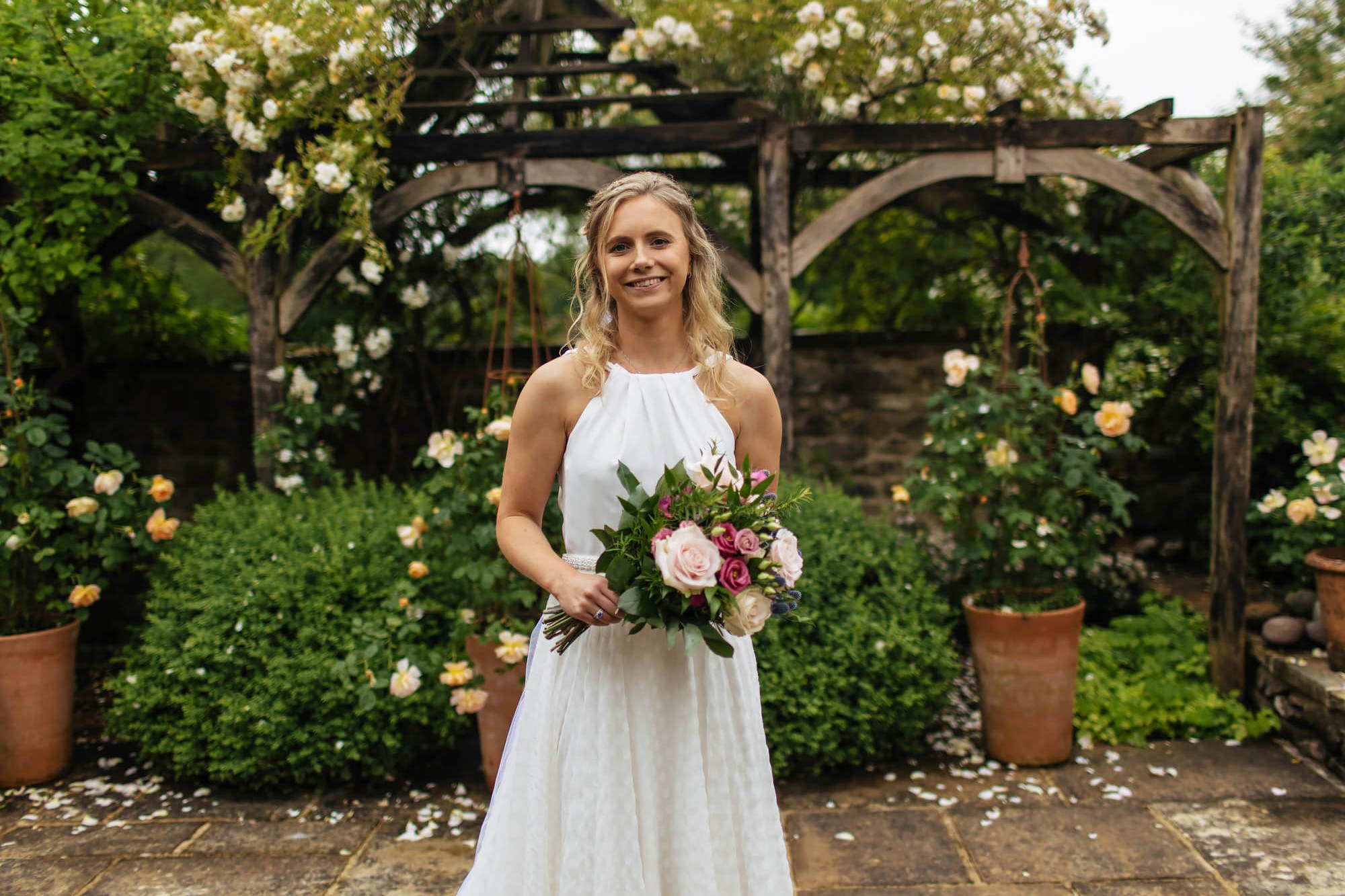 A solo portrait of the bride in the garden in Yorkshire