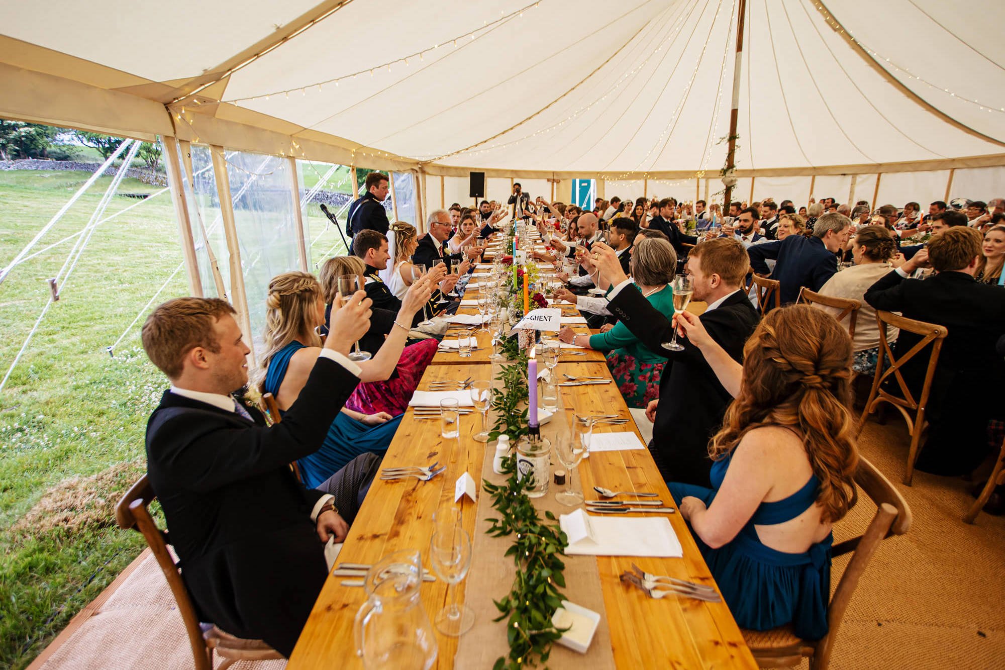 Wedding guests toasting the best man's speech