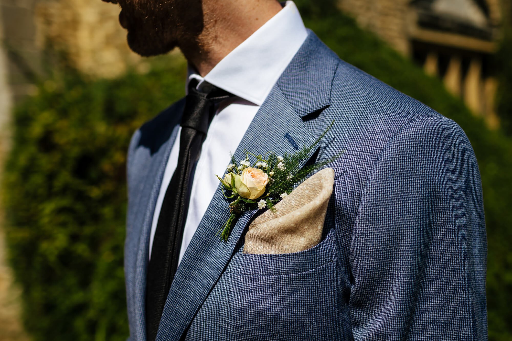 Groom's suit and buttonhole on his wedding morning
