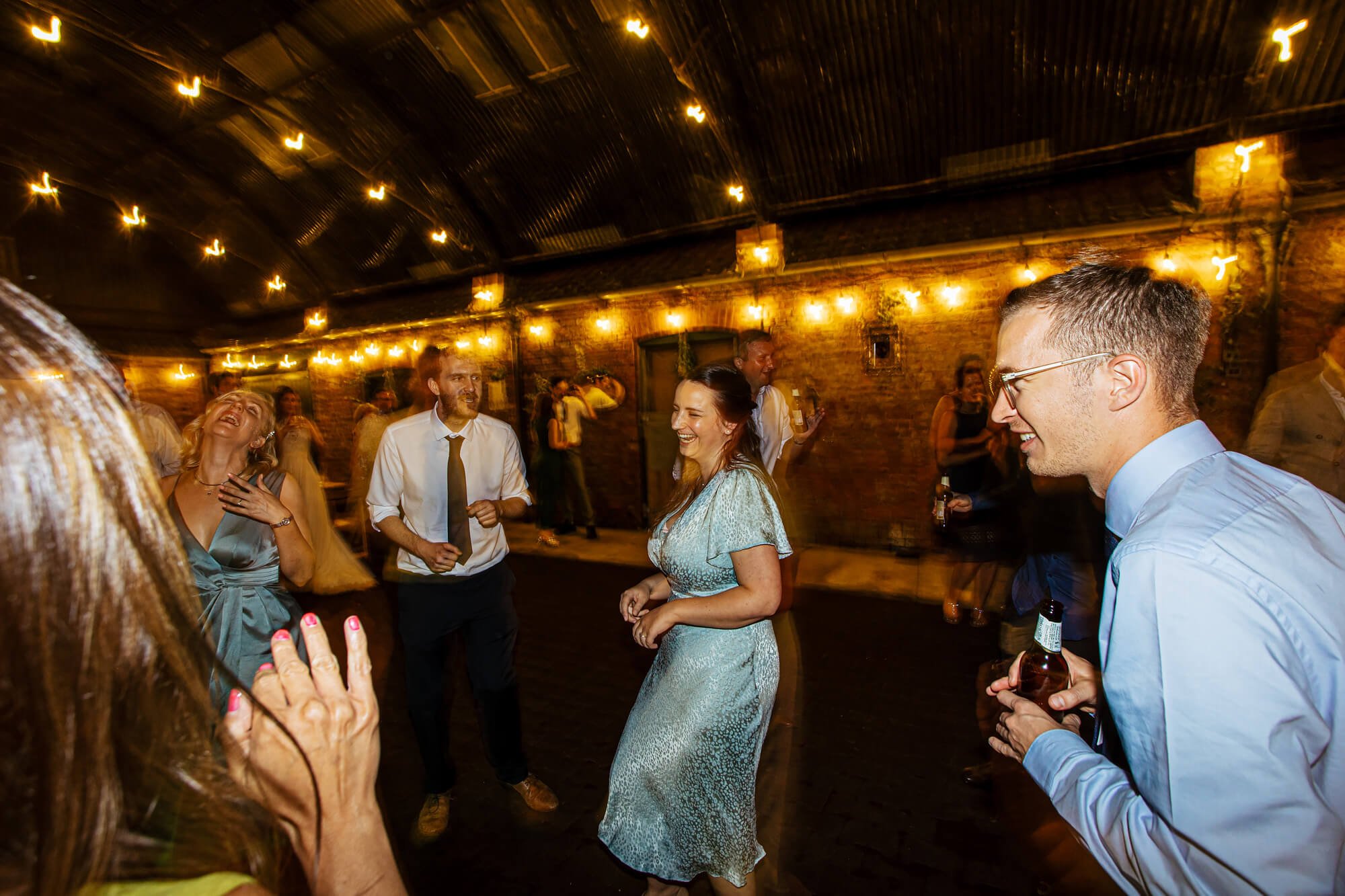 Guests having fun and laughing at a wedding