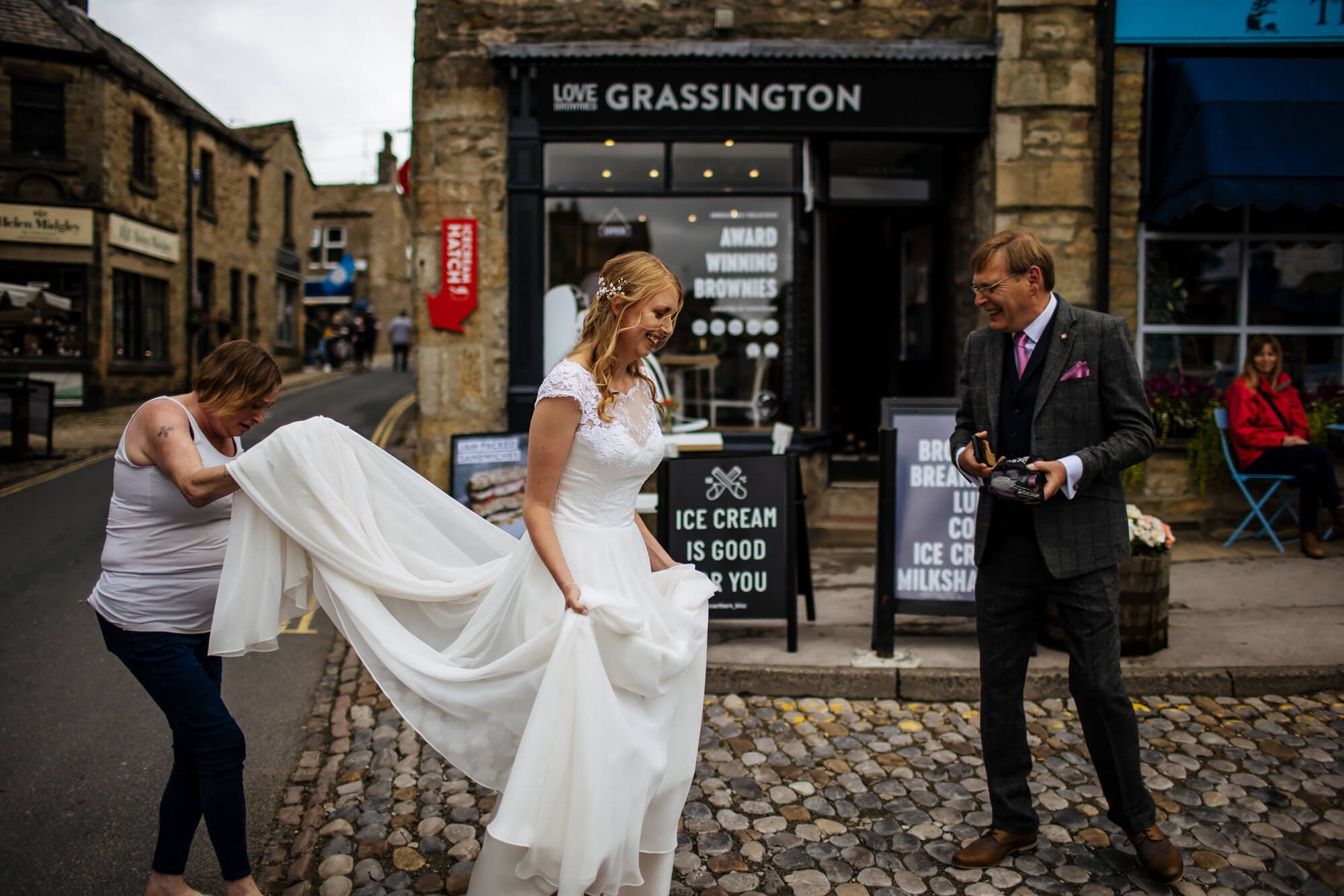 Bride walks through Grassington for her Yorkshire wedding
