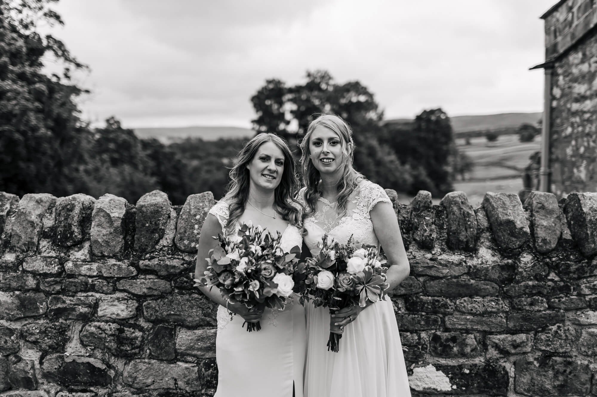 Portrait of the two brides on their wedding day